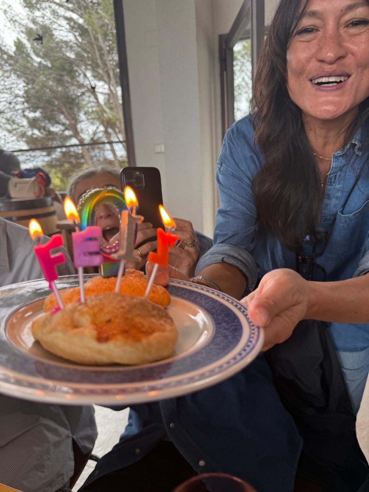 Stephanie Kirtley, Encantada World's Co-Founder, serving birthday cake to a client on a day out in Requena, Spain.