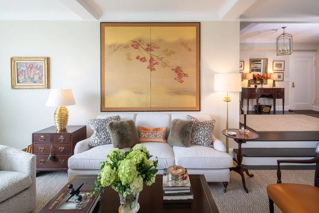 Prewar Sutton Place living room with tailored furnishings and large floral artwork by RI Architecture