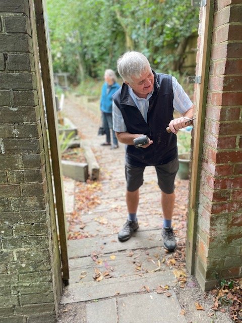 Howard James fixing lock on gate after break- in