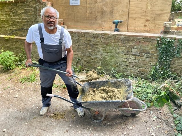 Nigel working on wall repairs