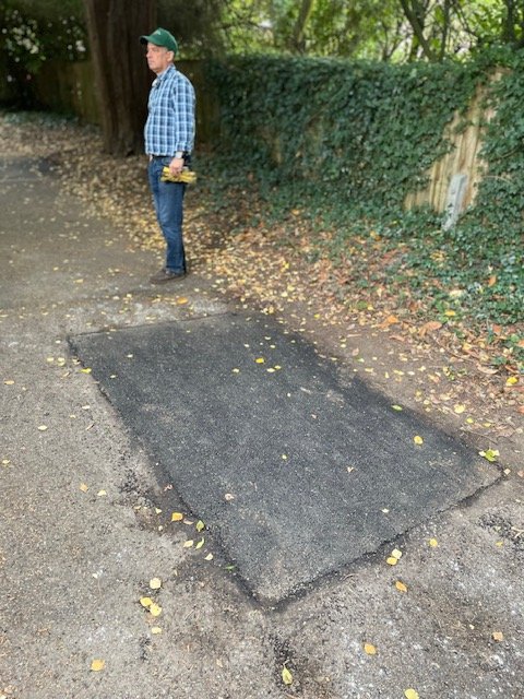 Alastair McPherson inspecting path repaired by council