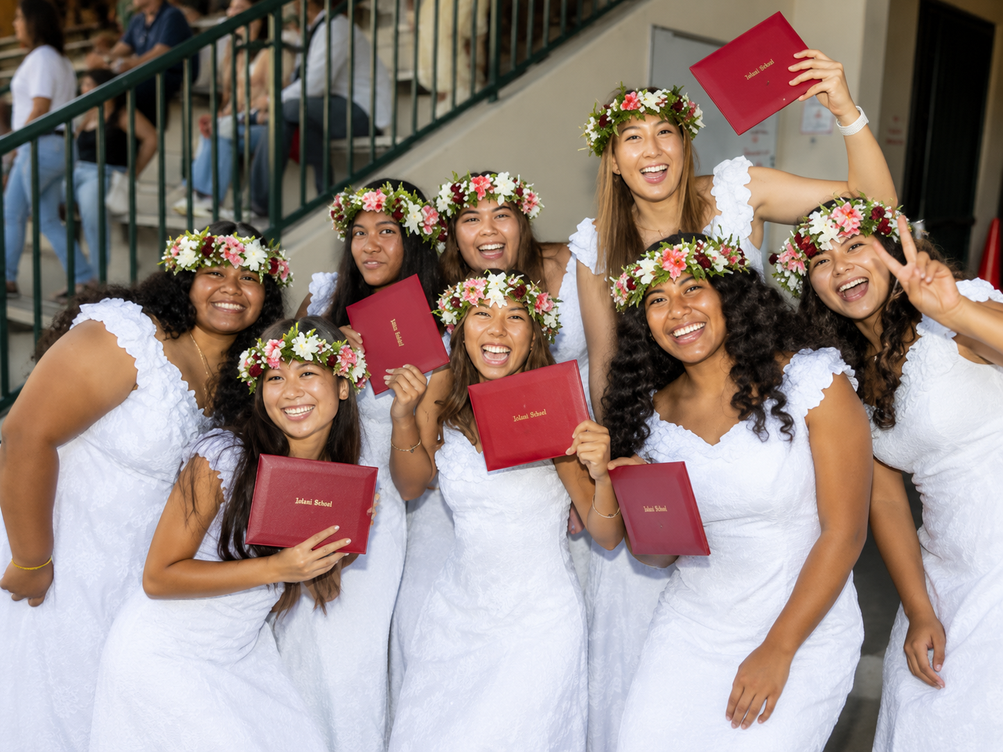 girls wearing white graduation dress in Hawaii