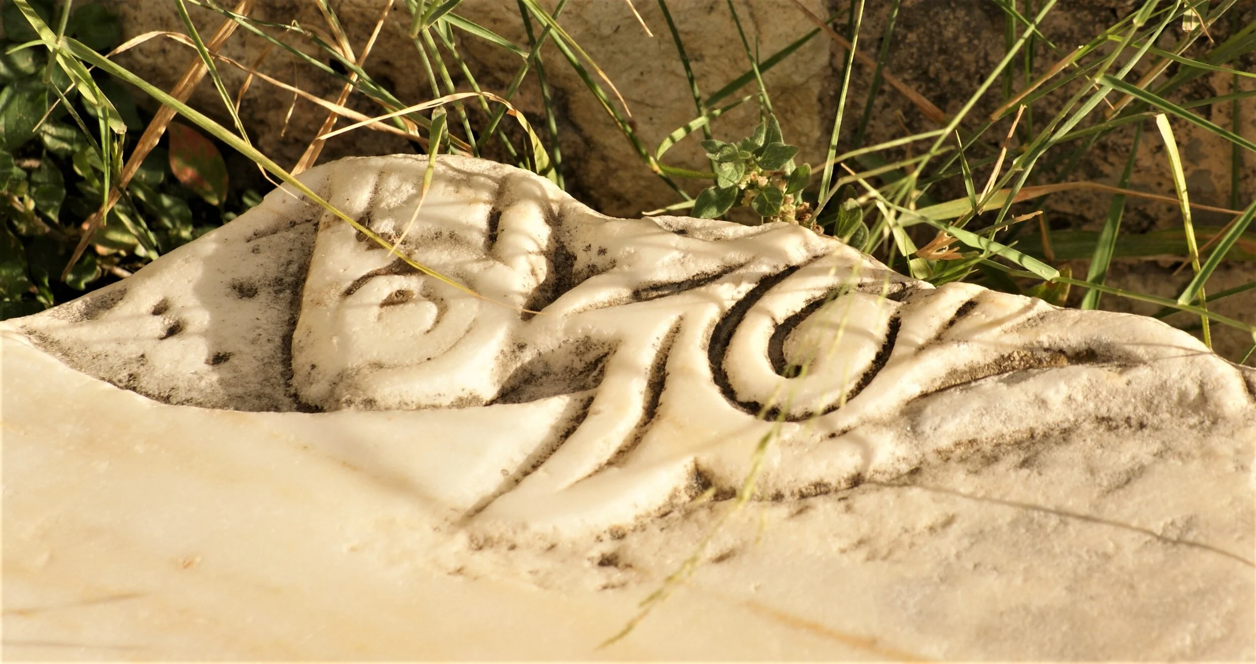 Carved Marble Stone in the Grass