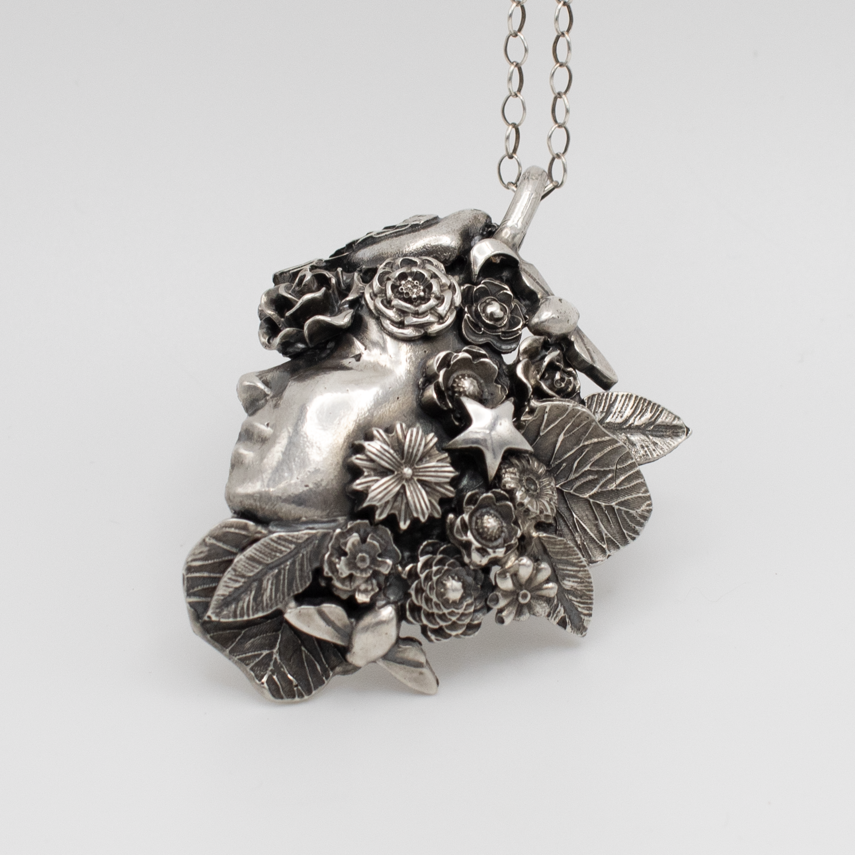 Garden Goddess Pendant: Birds, bees and stars.