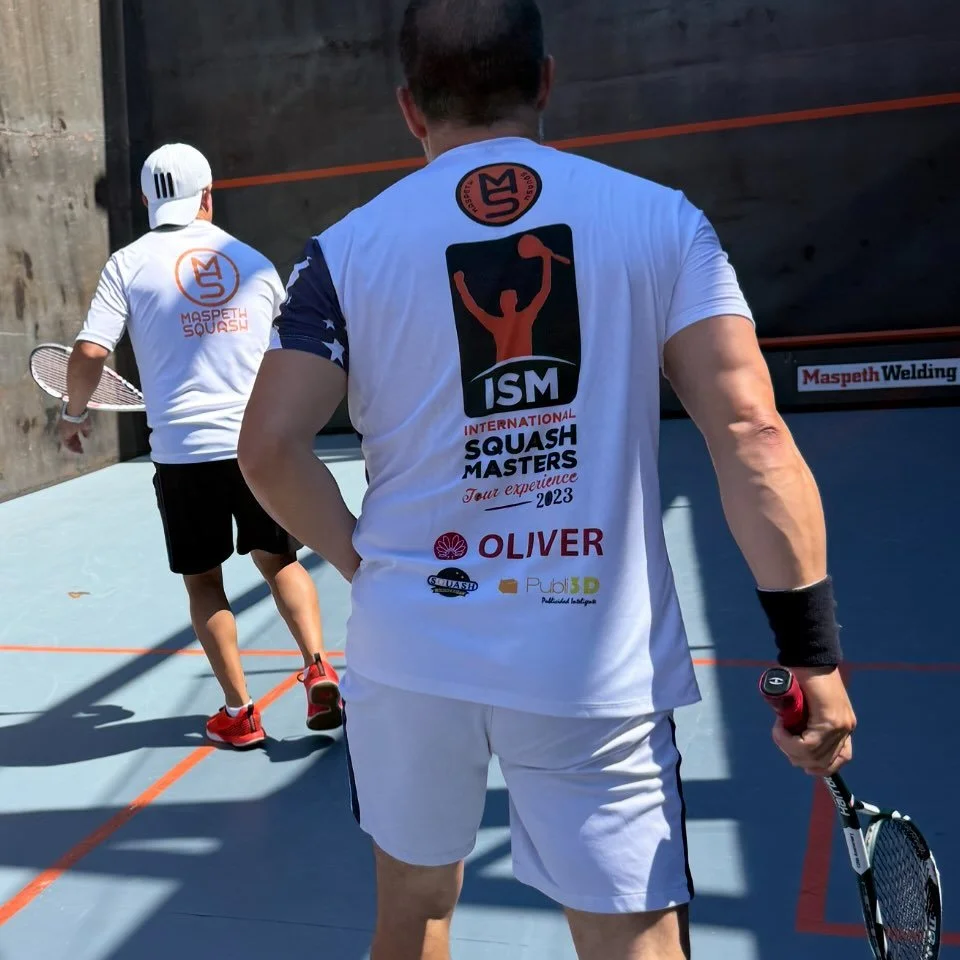 Swag. Paul wearing our first shirt from the 2021 International Squash Masters and JJ wearing our 2026 NYC Summer Squash Tournament tshirt. 

#squash #swag

Do you have a favorite tournament T-shirt?