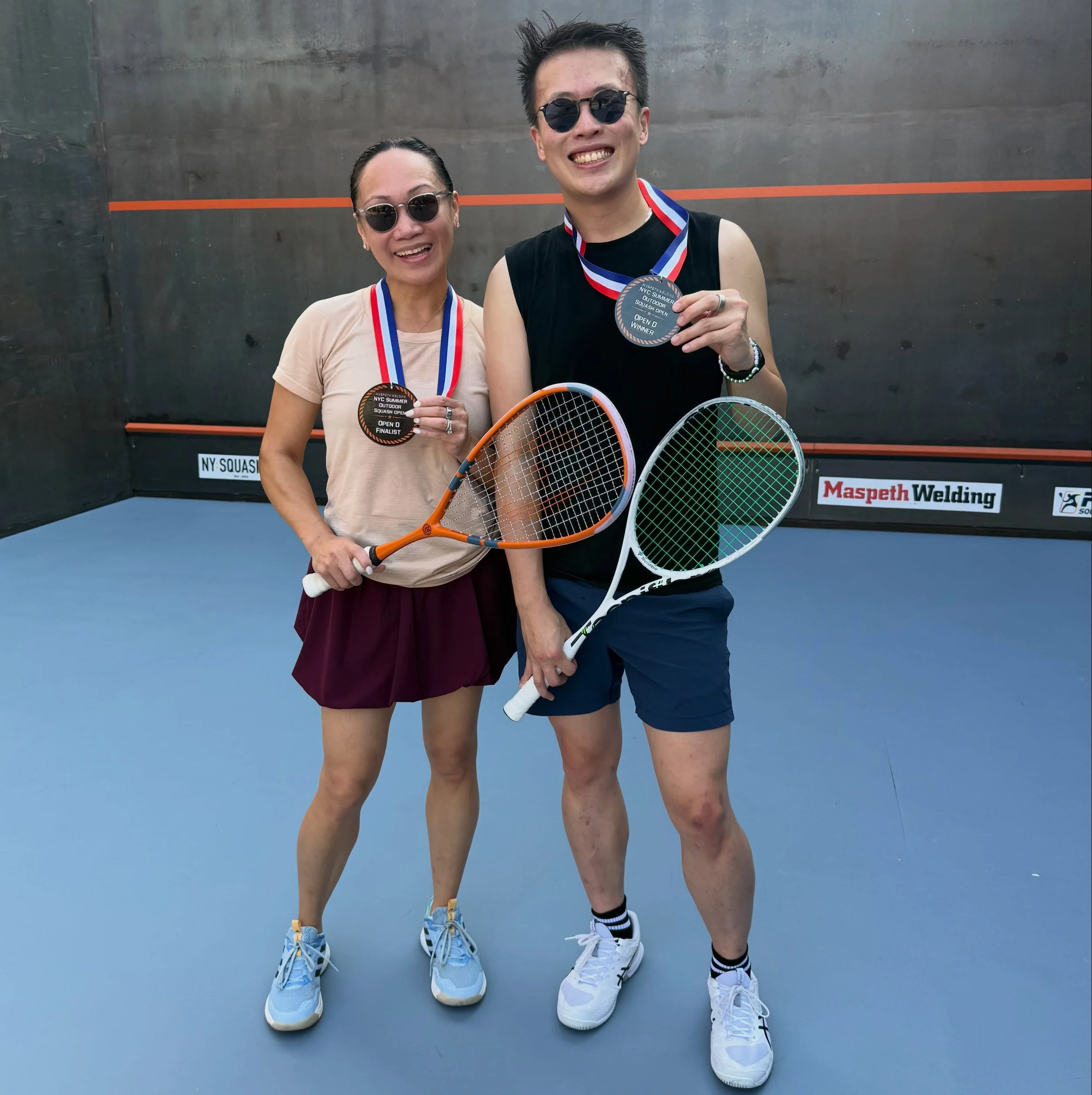 Congratulations to Larry Au, winner, and Vera Galvez., finalist in the NYC Summer Outdoor Squash D Championship on the steel court in Maspeth. 

This is Larry&rsquo;s first squash tournament win!

Vera is on the House Team at Maspeth Squash and leads