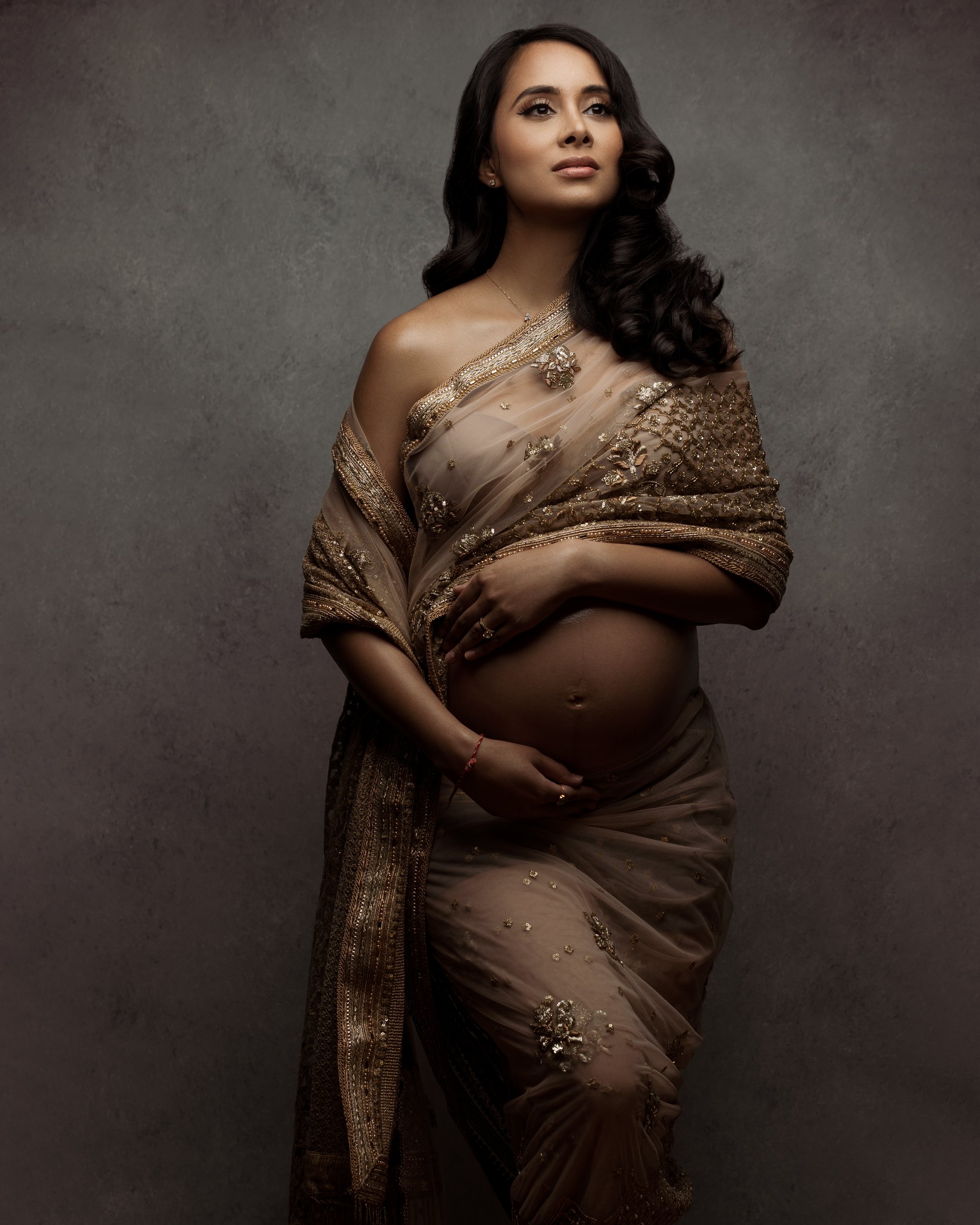 pregnant-indian-woman-in-golden-saree.jpg