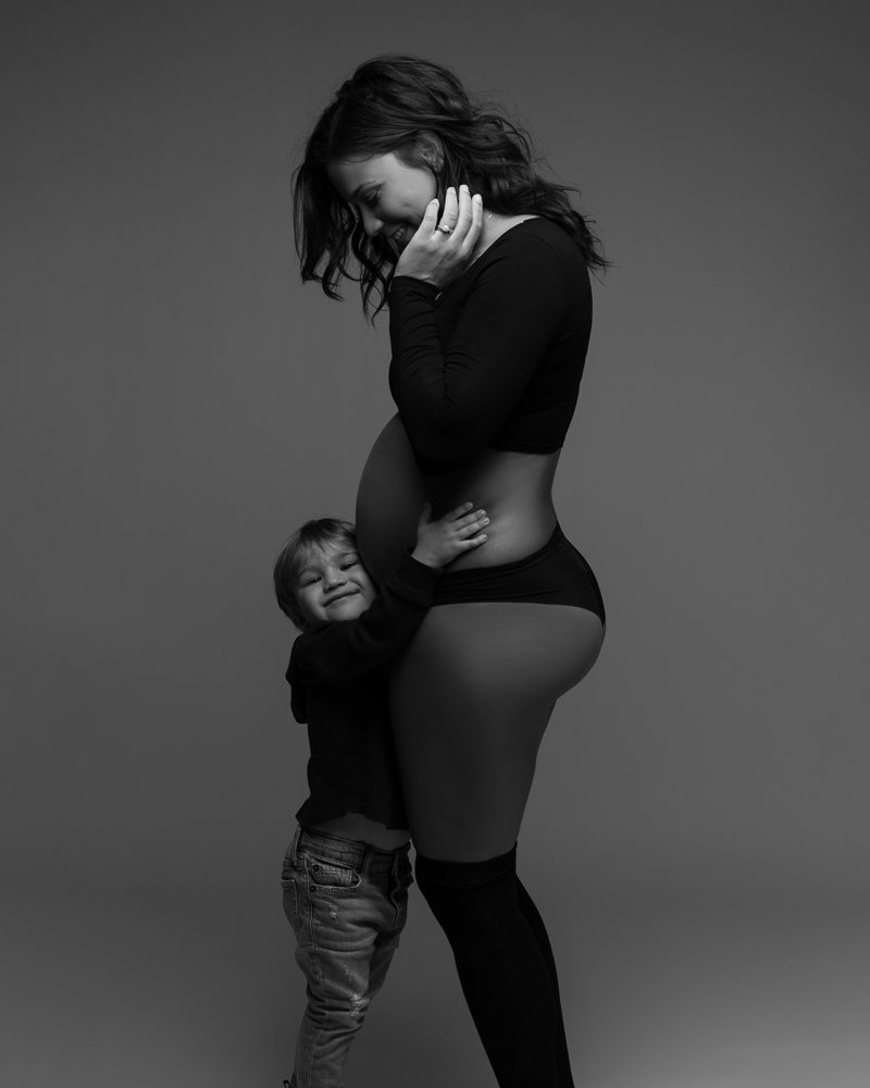 pregnant-mother-in-black-crop-top-in-underwear-with-son-black-and-white.jpg