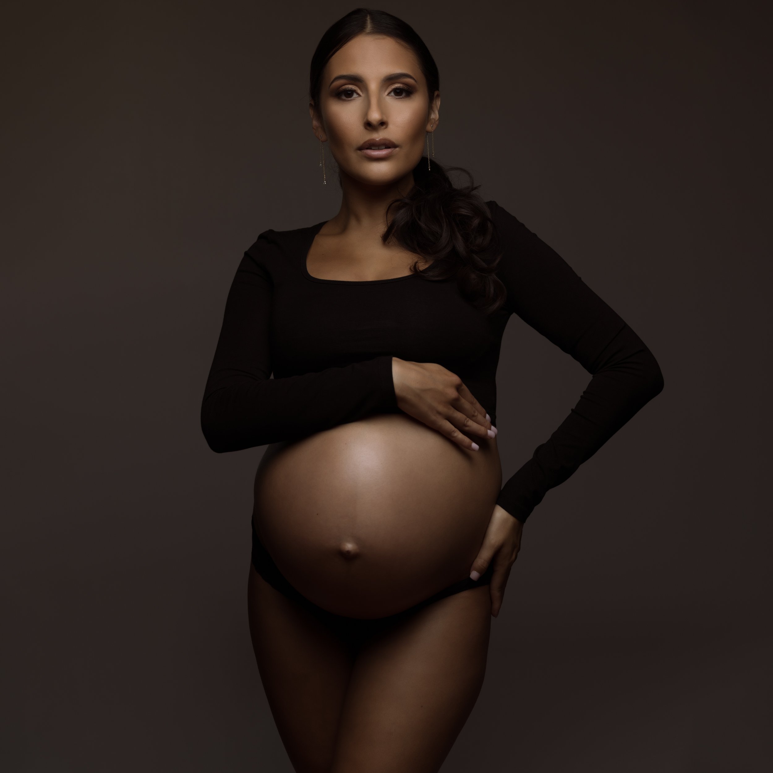 beautiful-pregnant-woman-in-black-long-sleeve-crop-top.jpg