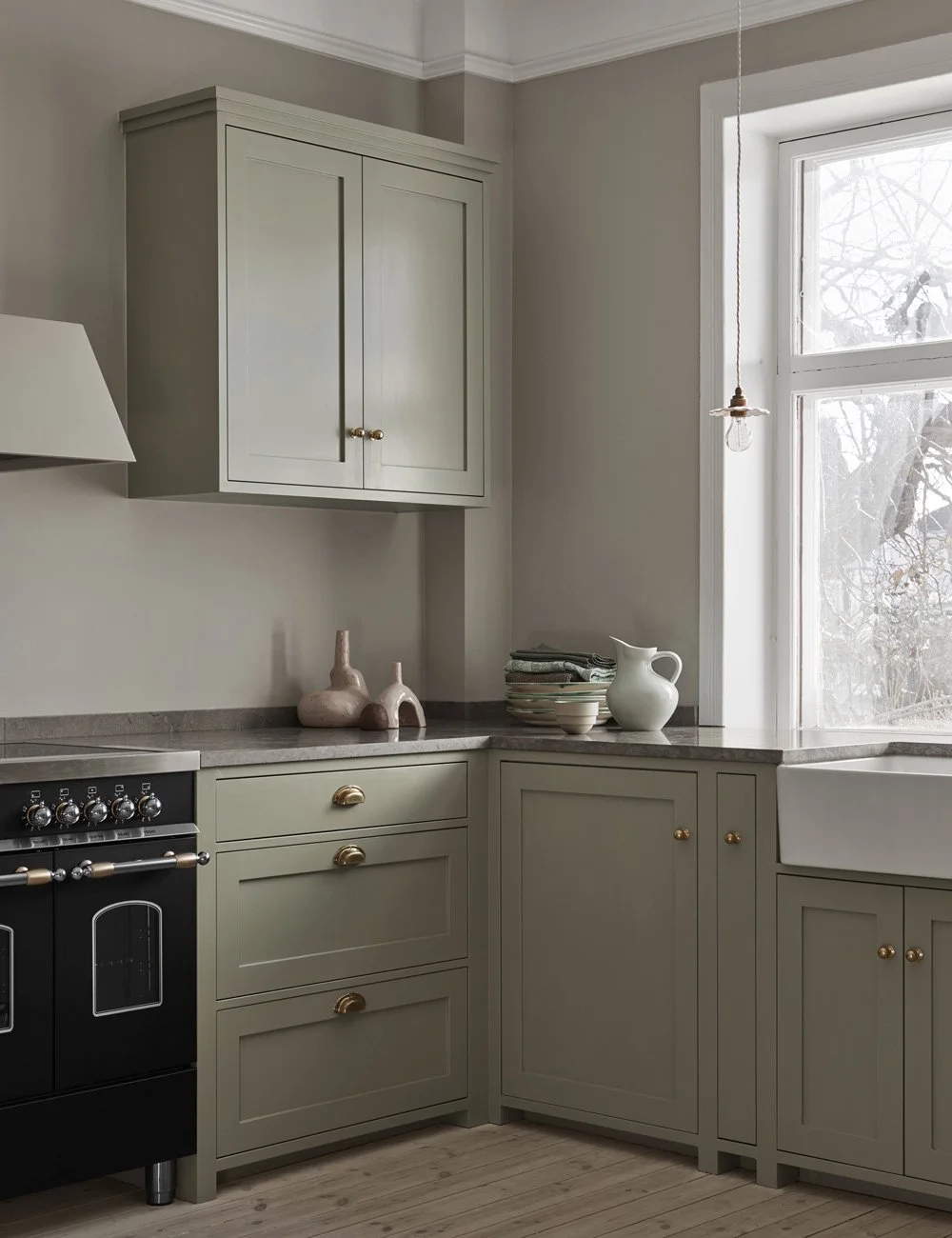 The hand-painted sage green country kitchen