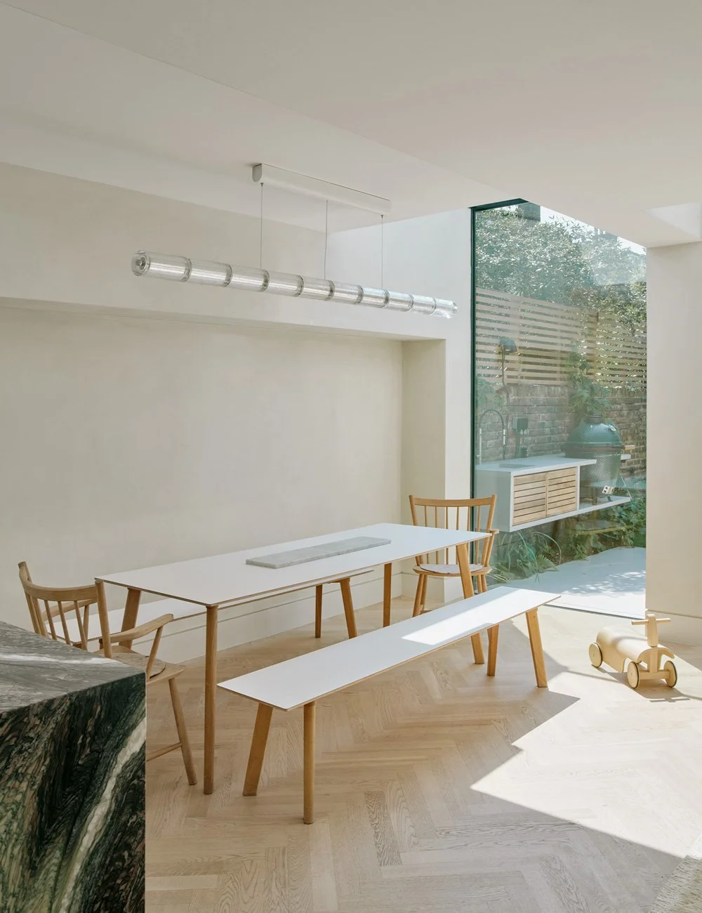 Scandinavian dining area with HAY furniture in a renovated Victorian townhouse in North London.