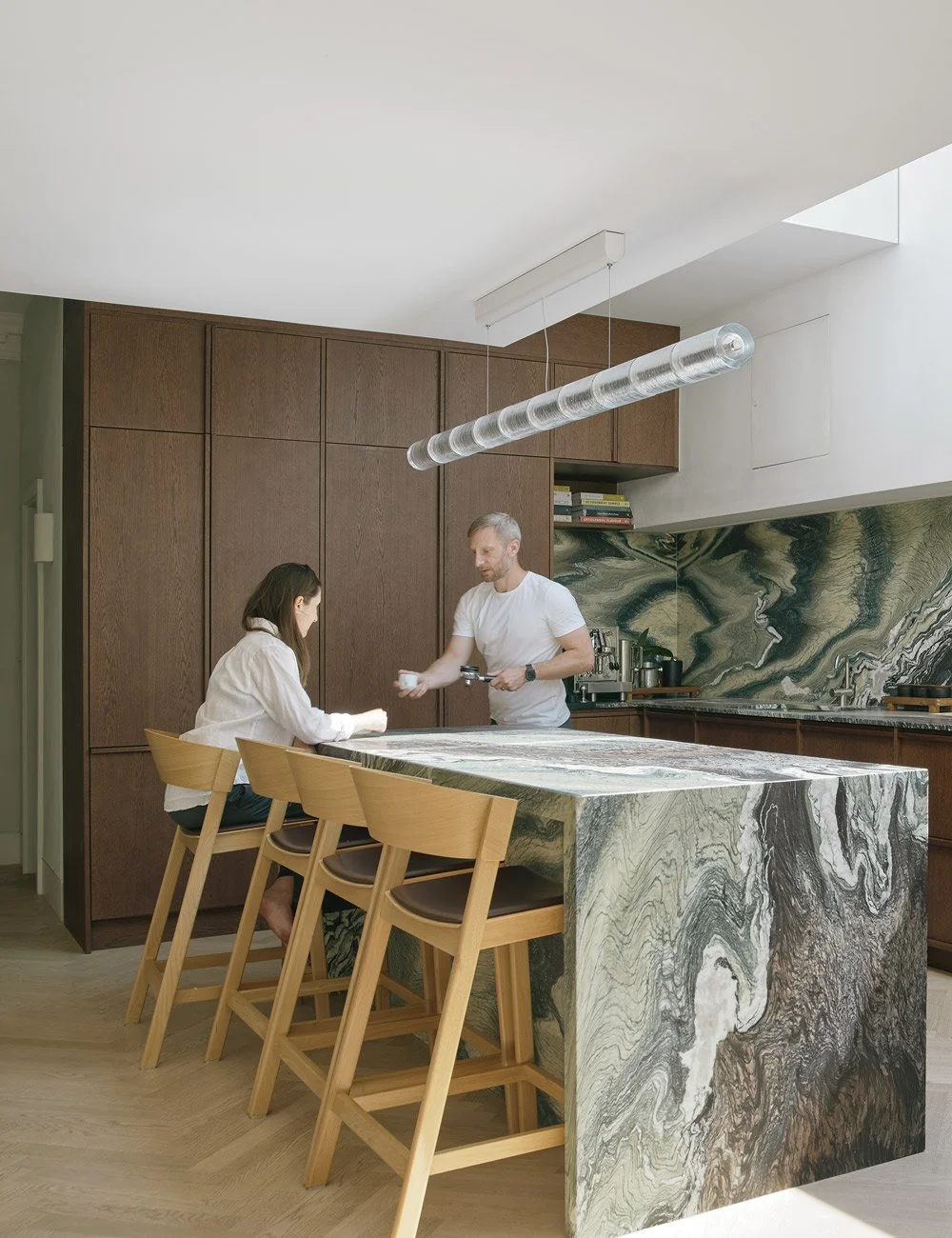 Homeowners Nils and Alexandra in their bespoke kitchen designed by Nordiska Kök.