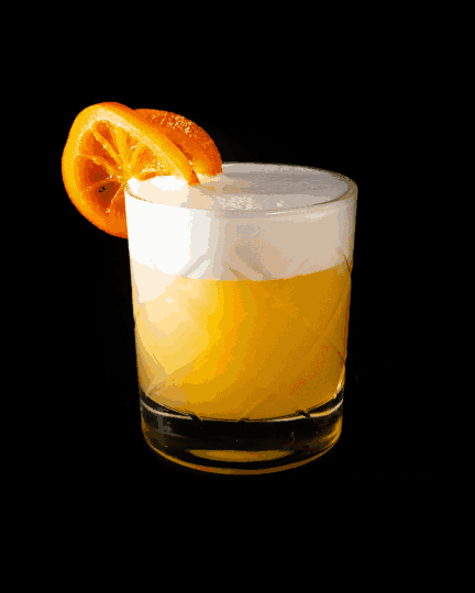 A glass of citrus cocktail garnished with an orange slice on black background.