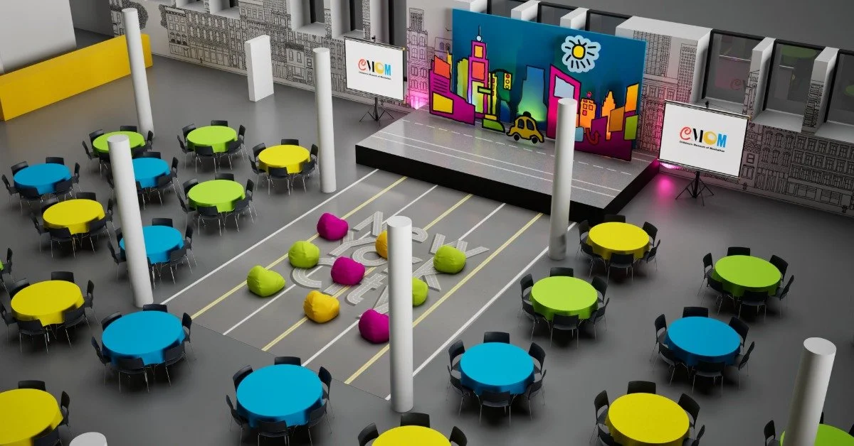 A diagram of a potential setup for an event space. There are multiple multicolored tabled set up around a dance floor.