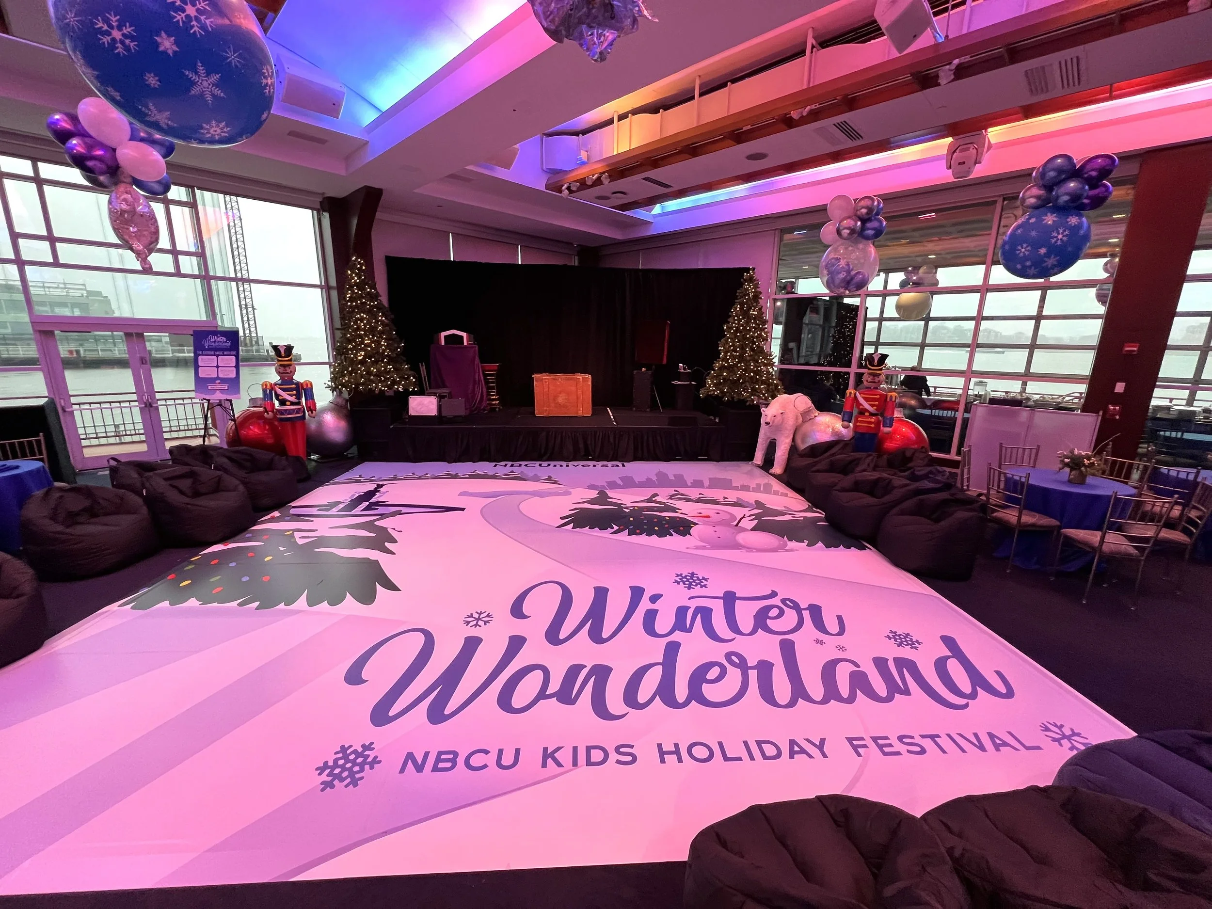 A large open area surrounded by bean bag chairs. The open floor has the words "Winter Wonderland" on it.