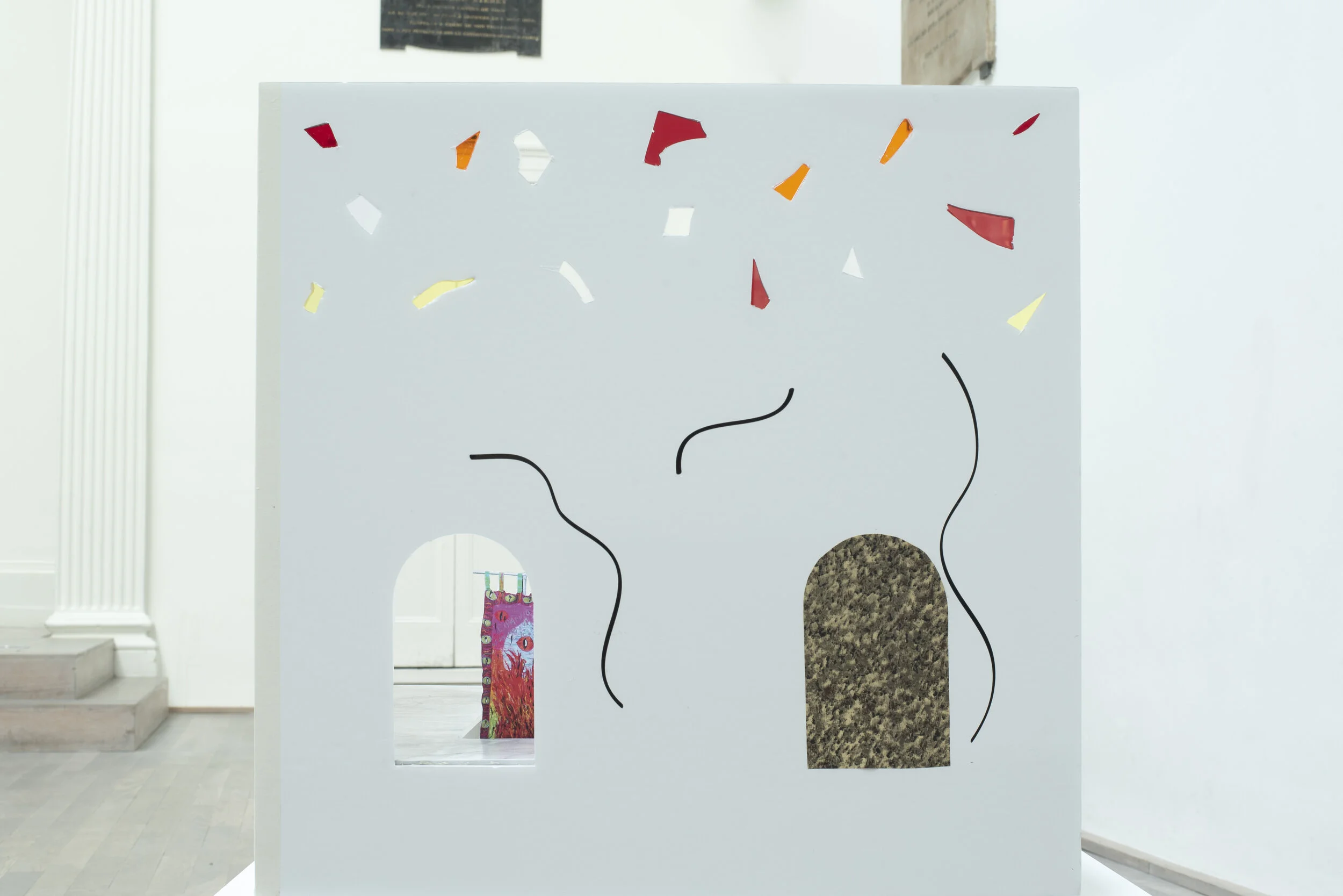 Lauren Godfrey's model, detail shot of:  Left to right: Morgan Markey Sun Bath (2019), photograph, original size 43 x 70cm, Sophie Goodchild Reheating the Soufflé (2020), hand felted lambswool, original size 215cm x 121cm Cyrus Shroff Three Vessels (