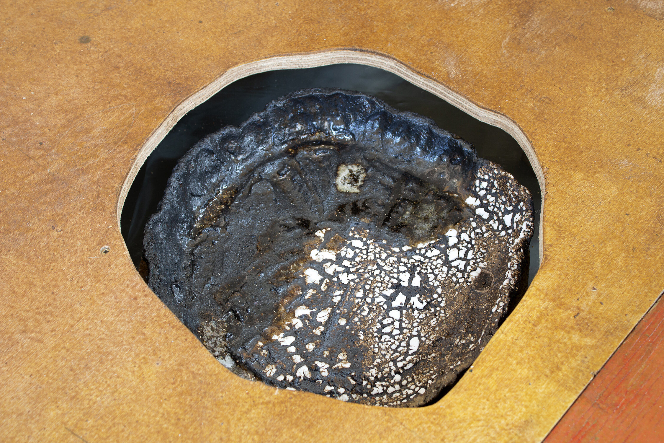 Clarty Vessel, stoneware, black crank clay, glaze and glass, 6.5cm x 36cm x 34cm, 2021, May Hands