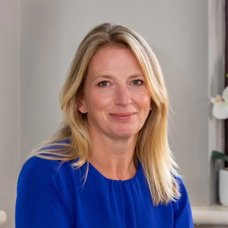 Image of Angela Brown - lady with long blonde hair and blue top smiling at the camera
