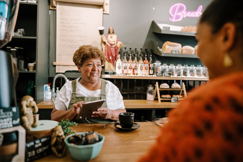 Woman-working-at-cafe-CfAB-1280x854.jpg