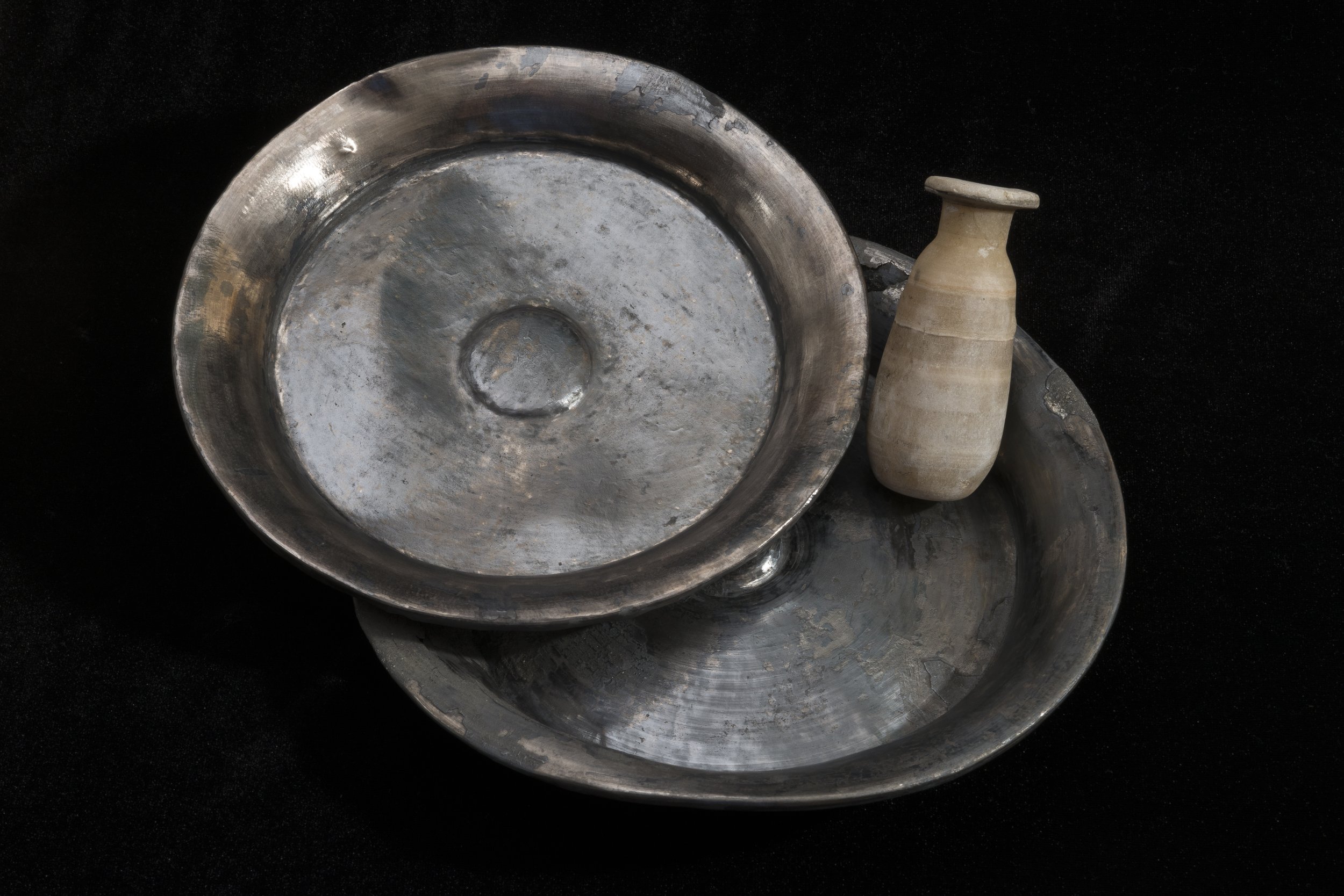  Two silver ritual dishes for libations for the gods from the temple treasure. Silver was considered extremely precious in ancient Egypt. An alabaster container for unguents and perfumes was found amongst them. Thonis-Heracleion, 5th century BC.&nbsp