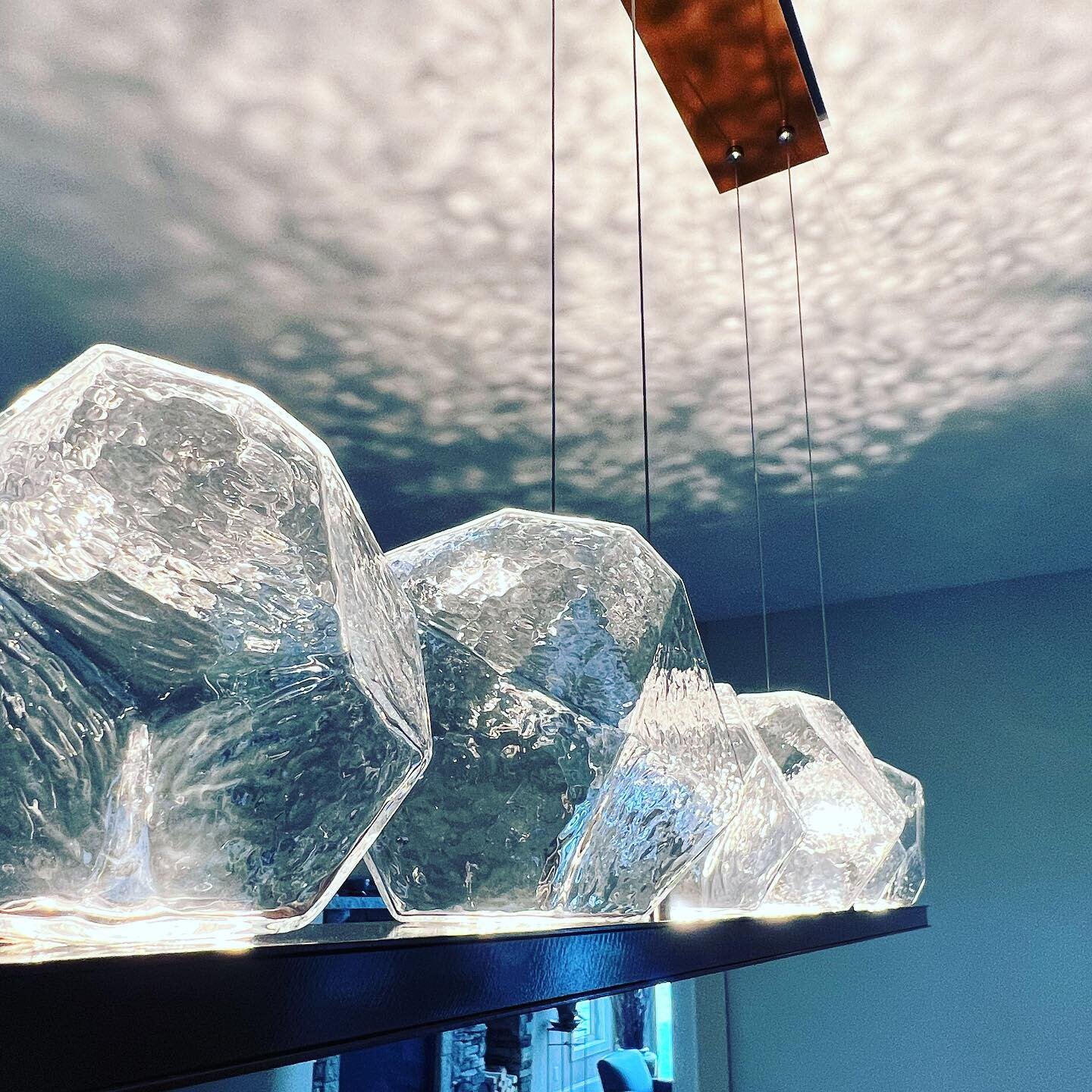 Warm days call for cool lighting 🧊!!! We are loving the Gem 💎 collection from @hammertonlighting illuminates this dining room and makes the ceiling another layer of the overall design! #hammertongem #interiordesign #nhinteriordesigner #lakehouse