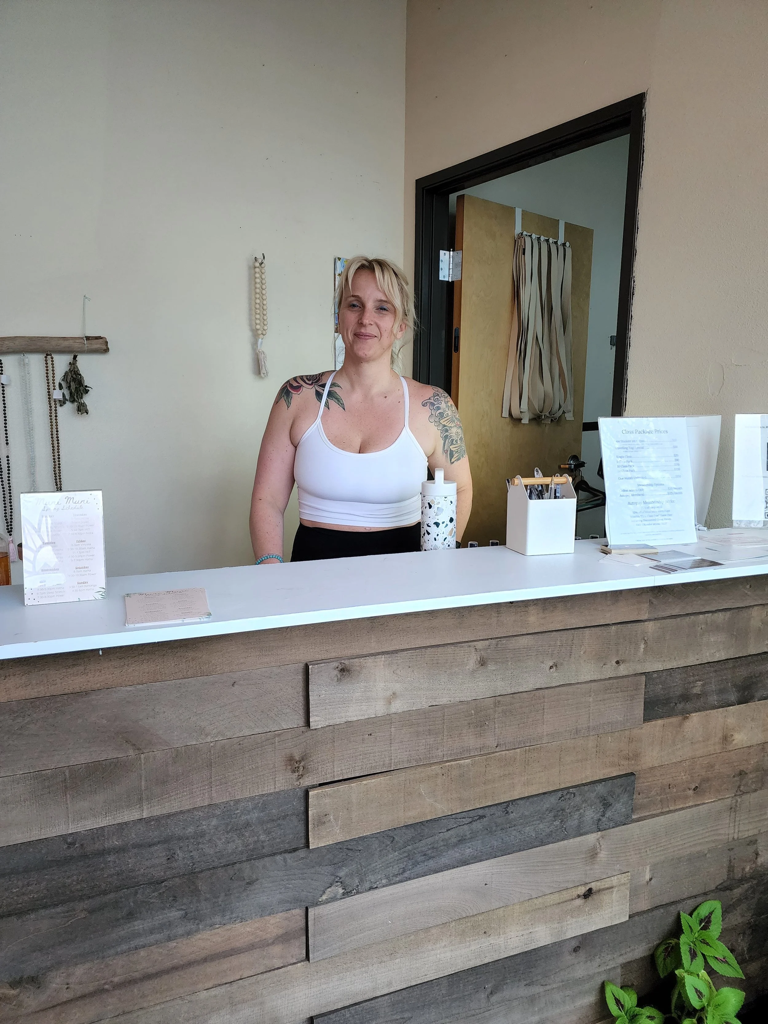 Kerry at front desk.jpeg