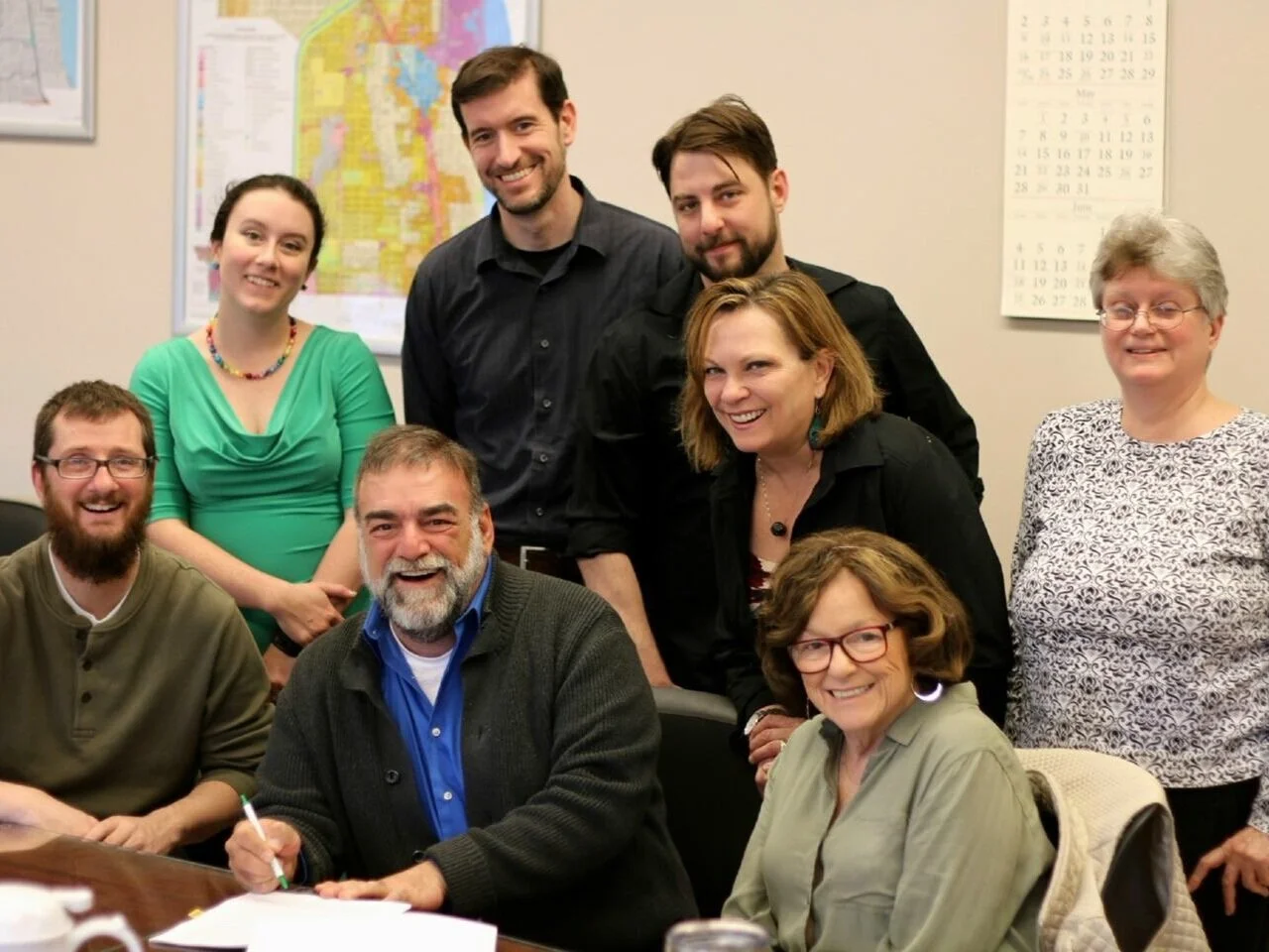 Ann joins city staff and members of Theo Ubique’s board for the signing of the lease of Howard Street Theater.
