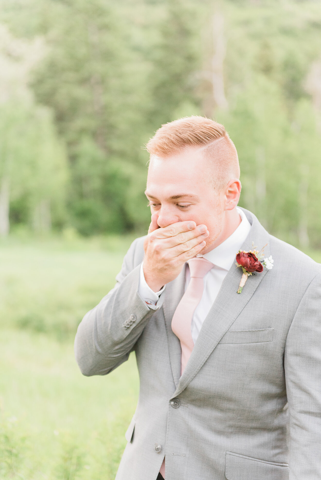  Happy groom with red hair and a light gray suit with a pink tie wearing a red rose for a boutonniere in Maryland by Jacquie Erickson photography. maryland wedding photography family photography easy and fun photographer light photography best outdoo
