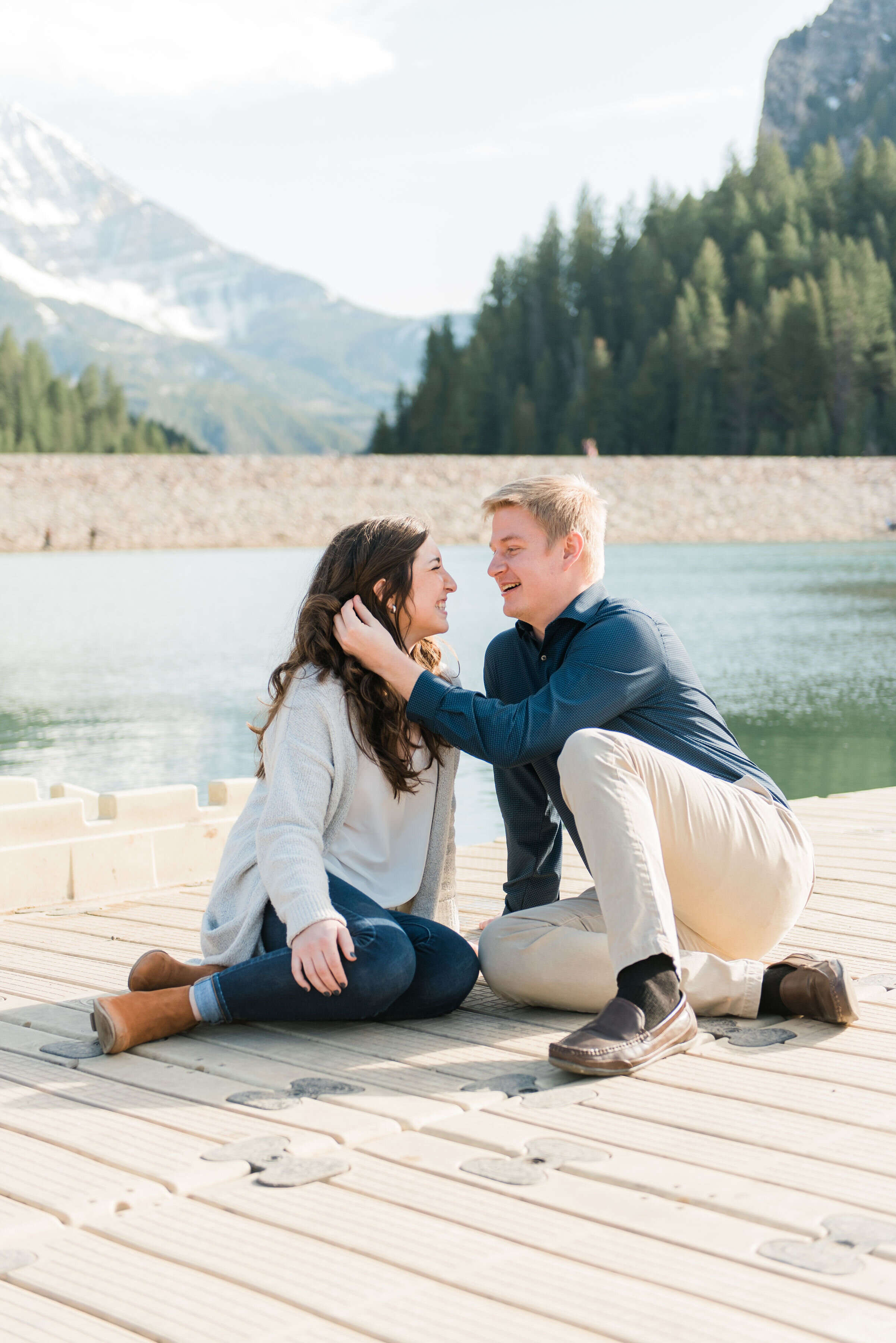  Jacquie Erickson Photography captures this in-love couple’s engagement photos on a brisk winter day in Maryland. groom moving brides hair behind ear, pier engagement photo, winter maryland photo session location, professional Maryland photographer #