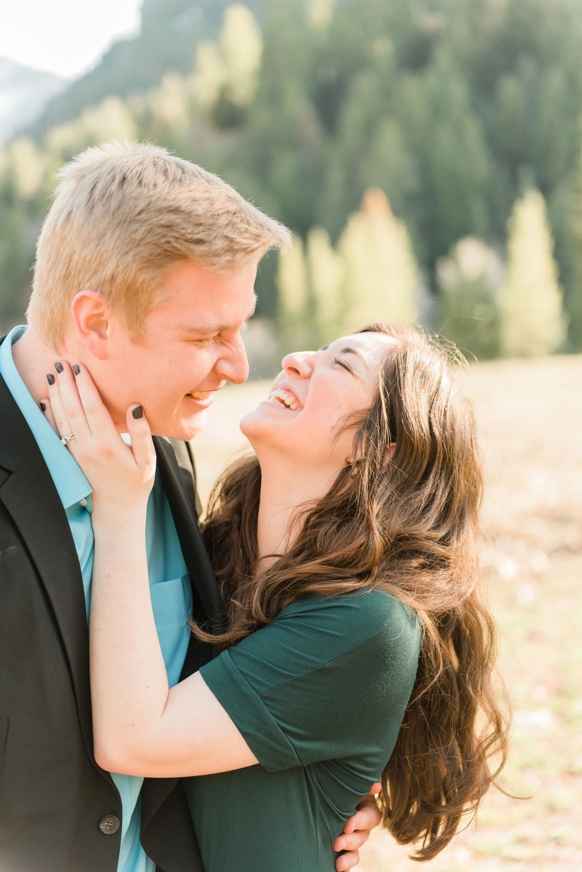  Laughing under the warm Maryland winter sun, Jacquie Erickson Photography captures engaged couple embracing in Maryland. dark gray womens nail color, engagement photo dark gray nail color, womens modest short sleeve emerald green dress, bright robin