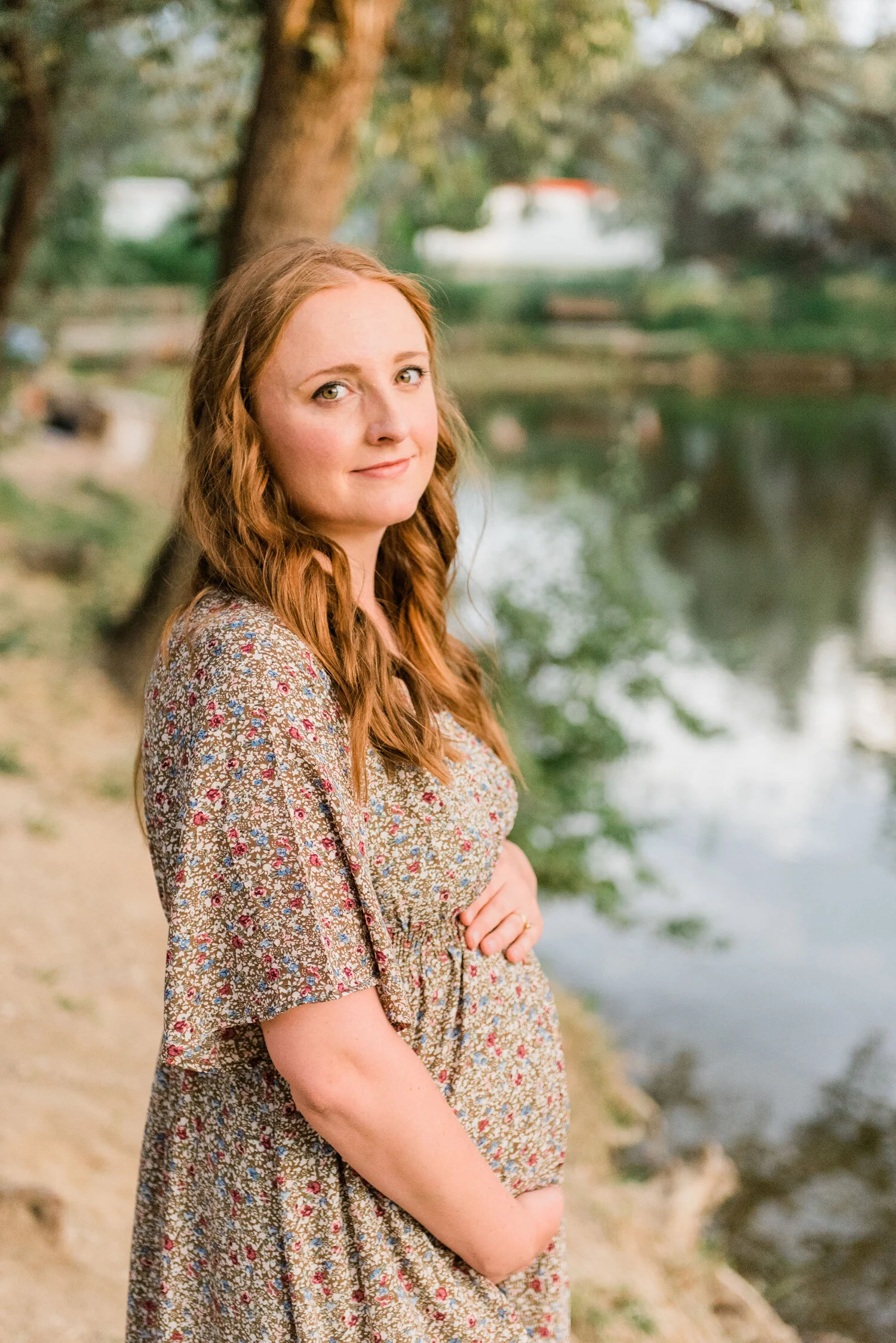  Baltimore, Maryland maternity photographer, Jacquie Erickson Photography captures this expectant mother’s portrait beside a duck pond. baby bump photos, professional maternity photographer baltimore maryland, womens long curled auburn hair, elbow le