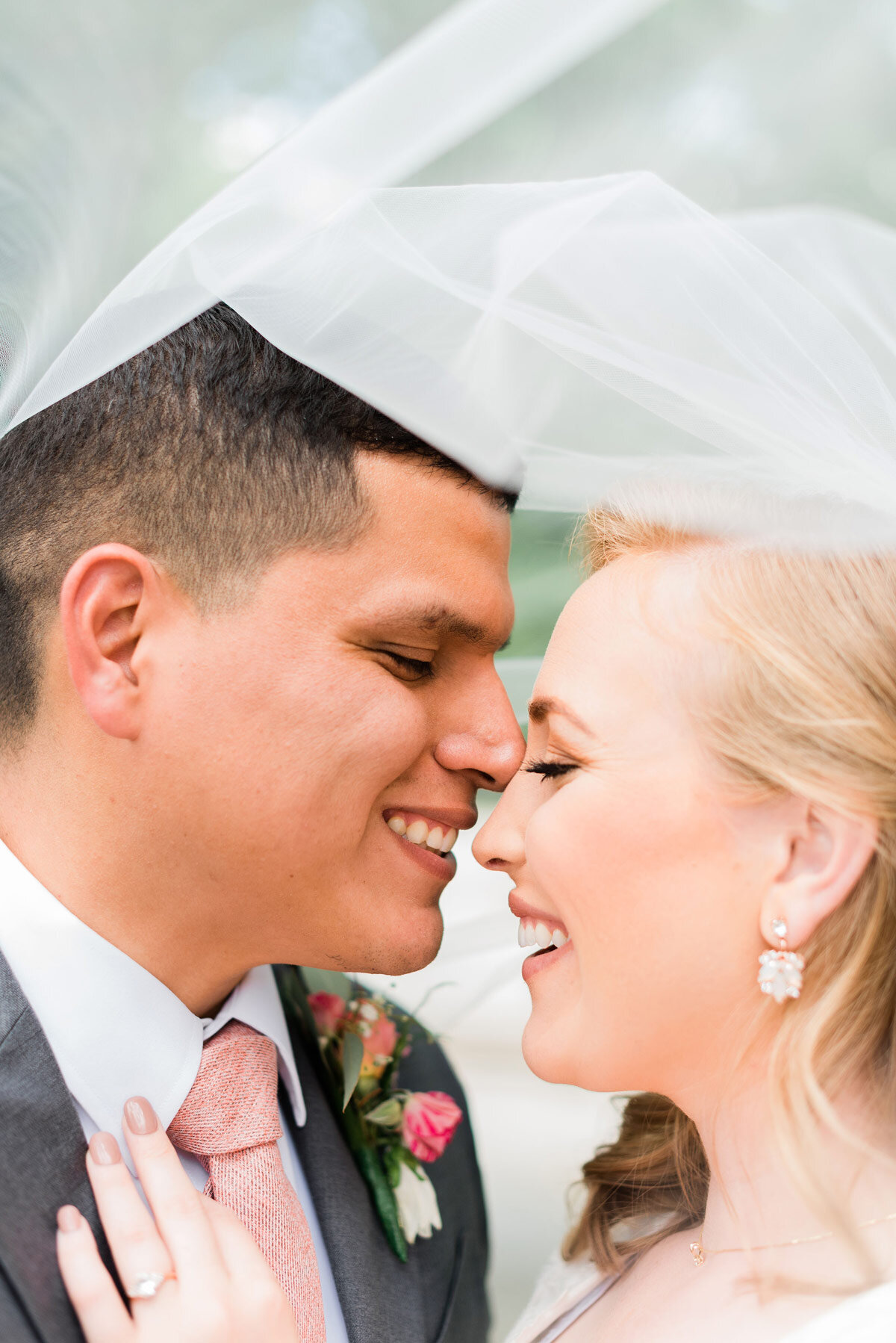  Peach Tree City wedding photographer captures a bride and groom kissing under the bride veil in springtime by Jacquie Erickson. veil kissing picture professional Georgia photographer light and airy wedding photos #jacquieericksonphotography #Jacquie