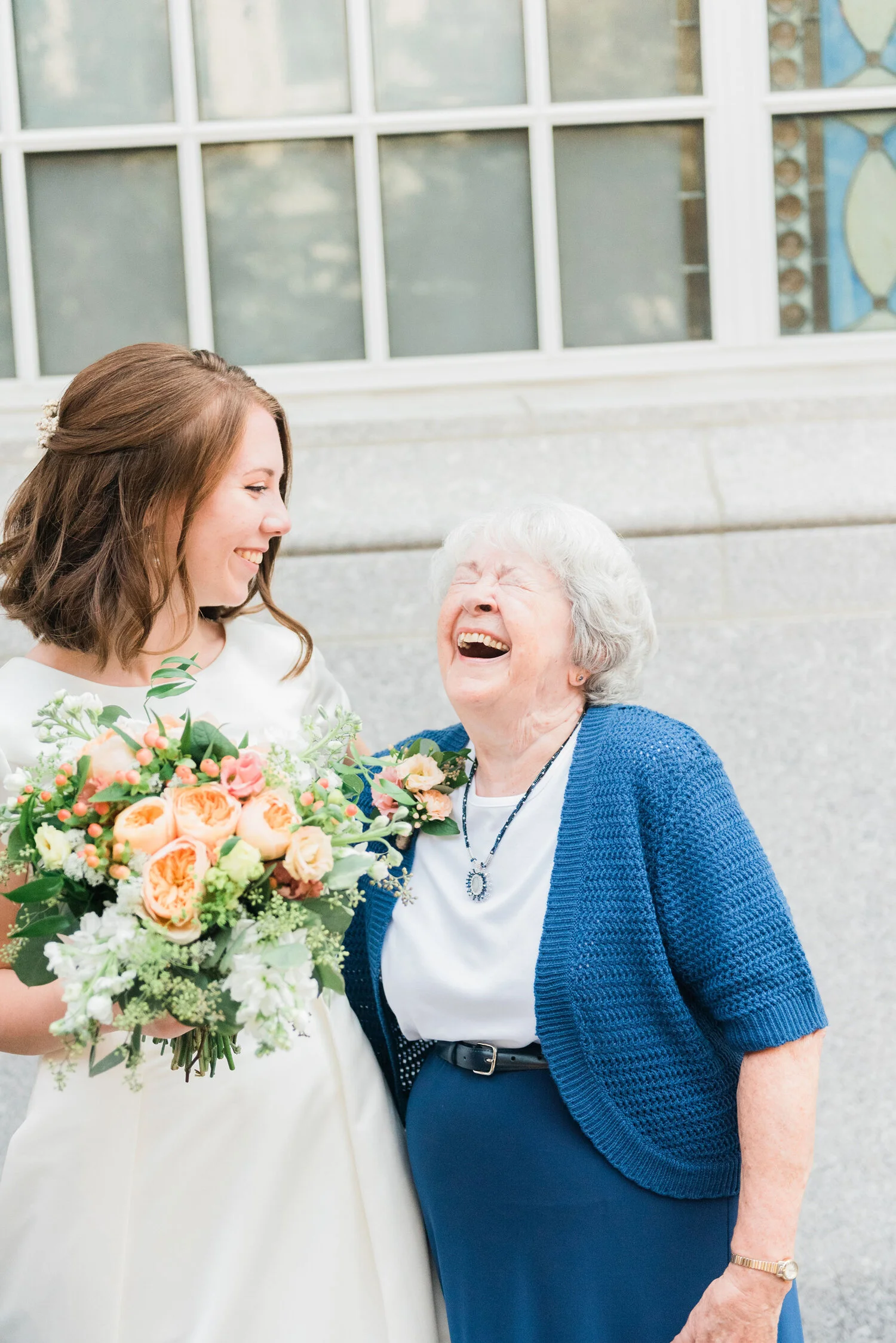  A bride and her grandmother share a laugh captured by Jacquie Erickson Photography. Pictures of people laughing happy wedding photos candid wedding photos bright wedding photos bridal hair inspiration ideas for wedding flowers blush wedding flowers 