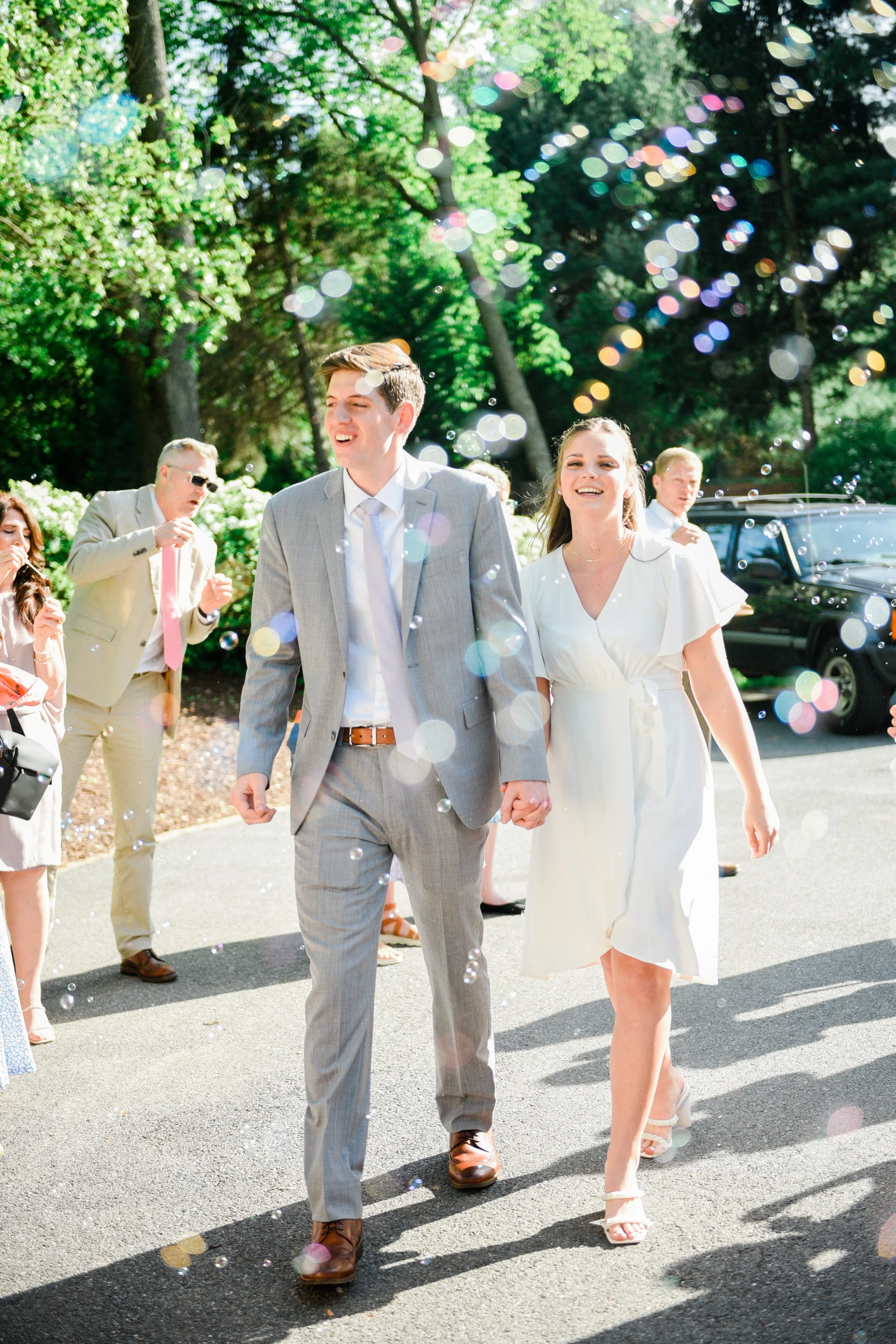  The bride and groom walk through a bubble send-off on their spring wedding day by Jacquie Erickson Photography. bubble wedding send off spring wedding send off ideas #JacquieEricksonPhotography #JacquieEricksonWeddings #SpringDCWedding #SpringWeddin