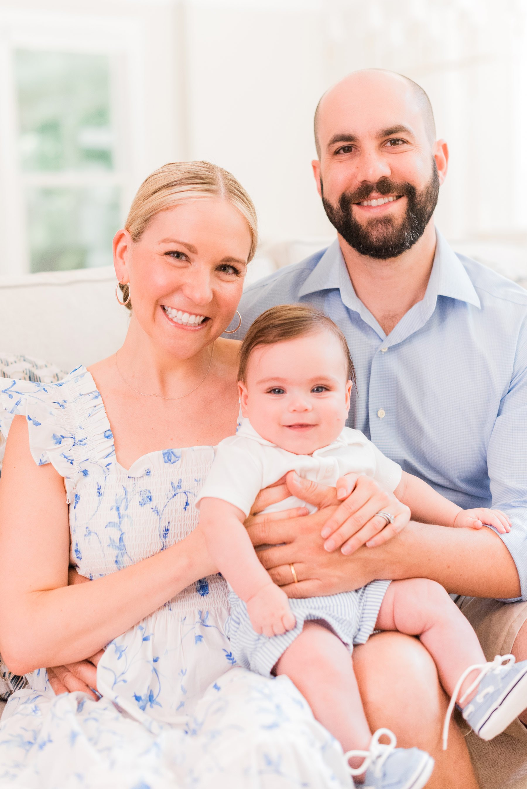 The cutest young family of three sit close together for an in-home portrait session by Jacquie Erickson Photography, an Atlanta based photographer.&nbsp; #inhomeportraitsessions #familyphotos #portraitphotography #atlantaphotographer #jacquieerickso