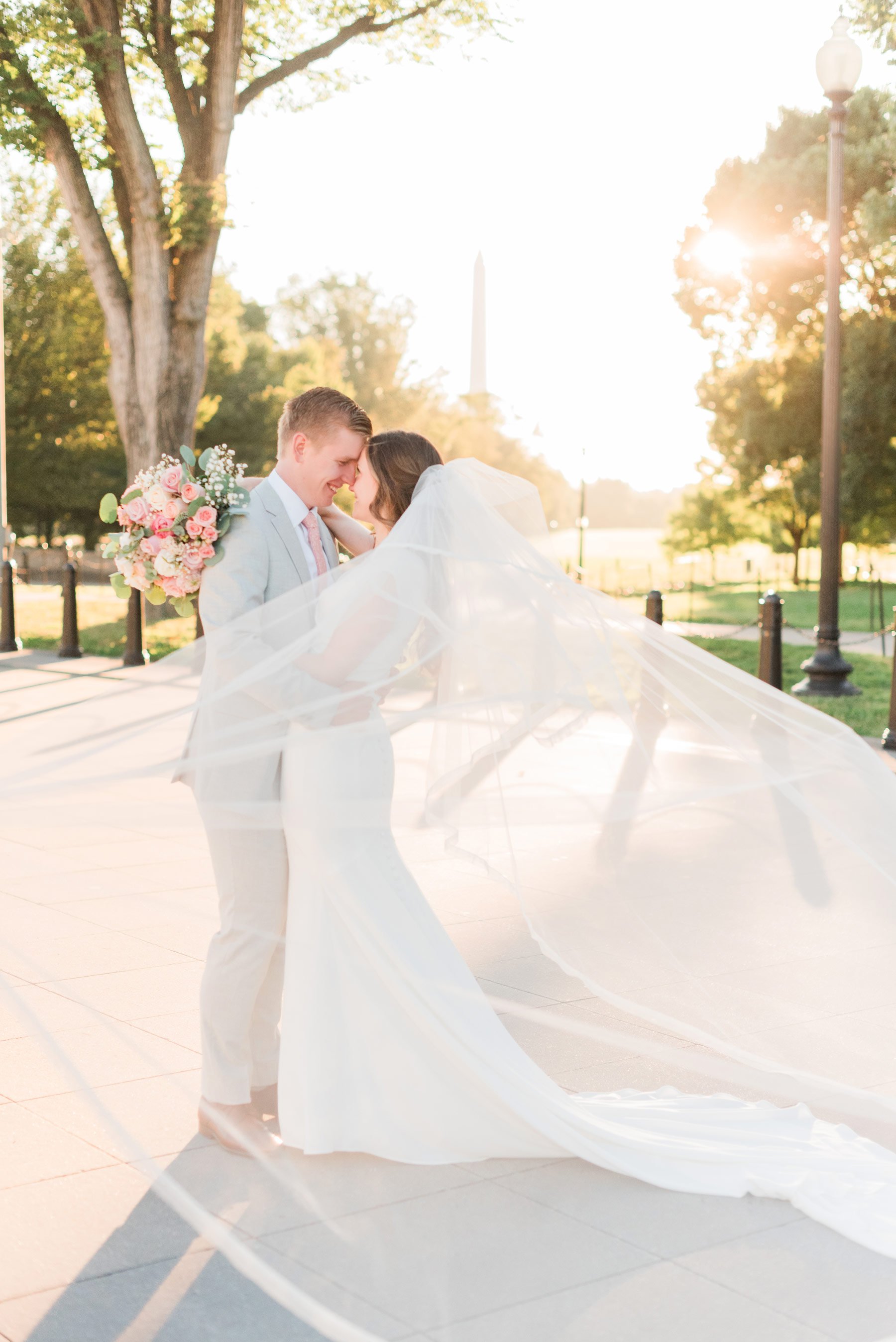   The modest bride’s veil is featured in this beautiful Washington DC wedding photo. #washingtondcphotography #washingtondctemple #washingtondcwedding #dcweddingphotographer #washingtondctemplewedding #eastcoastweddingphotographer #sunsetbridals #mo