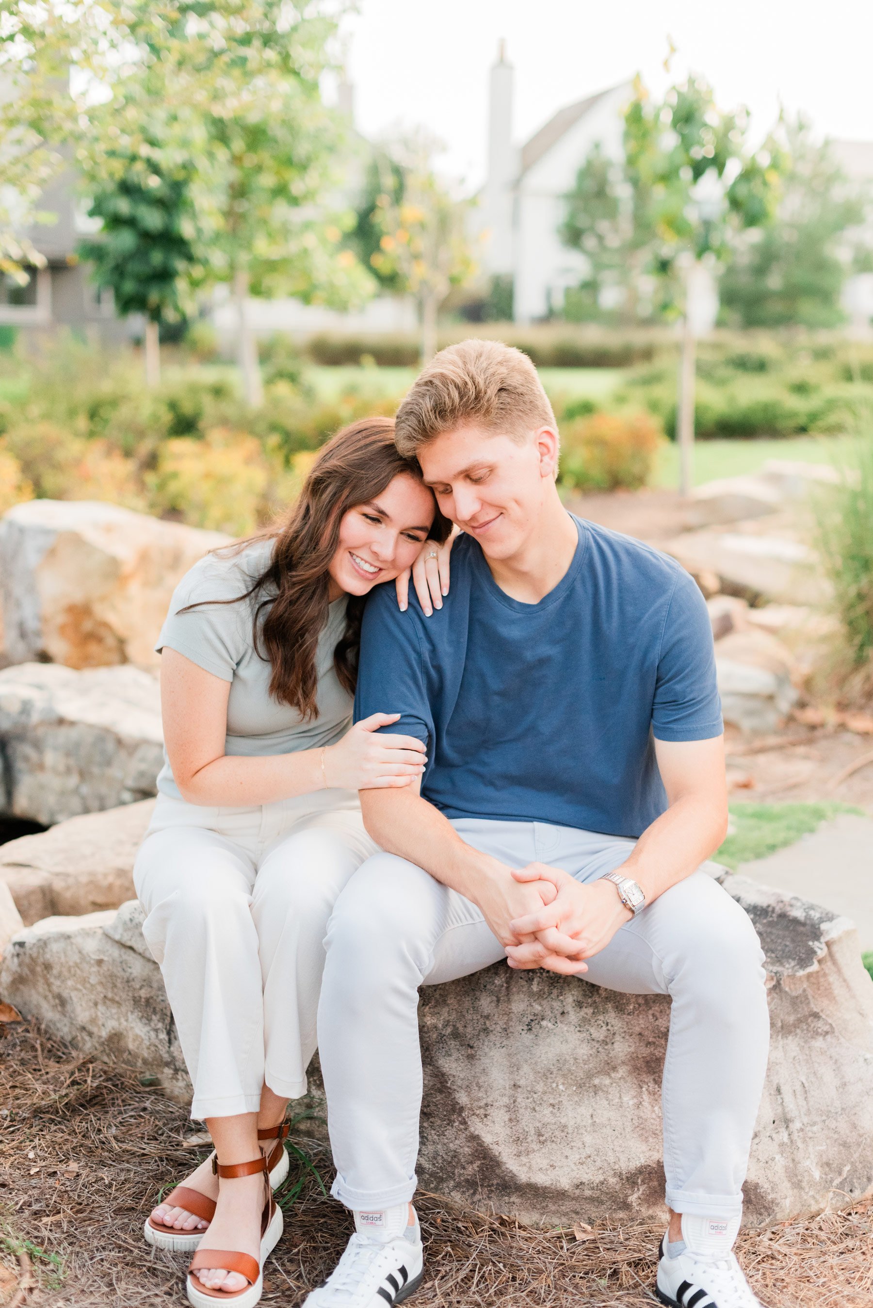    This cute couple snuggled up for romantic professional engagement photos in the park. #trilithstudios #georgiaweddingphotographer #fayettevillephotographer #fayettevilleengagementphotos #outdoorengagements #formalengagementphotos #reasonstobookeng