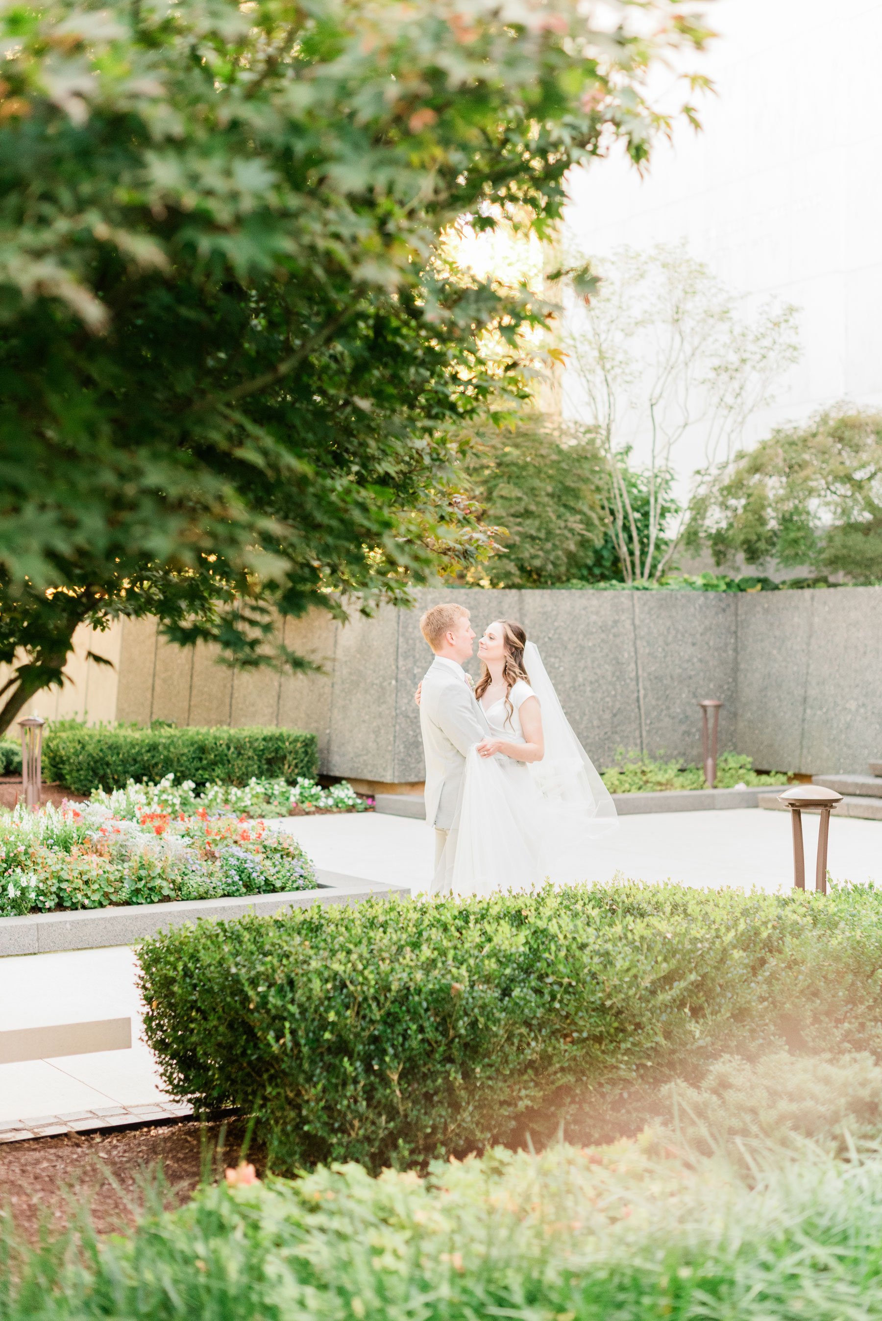    The bride and groom explore the beautiful washington d.c. temple grounds together. #washingtondctemplegrounds #washingtondcweddingphotographer #dcwedding #pinkwedding #ldsweddingphotographer #pinkweddingbouquet #washingtondctempleexit #eastcoastwe