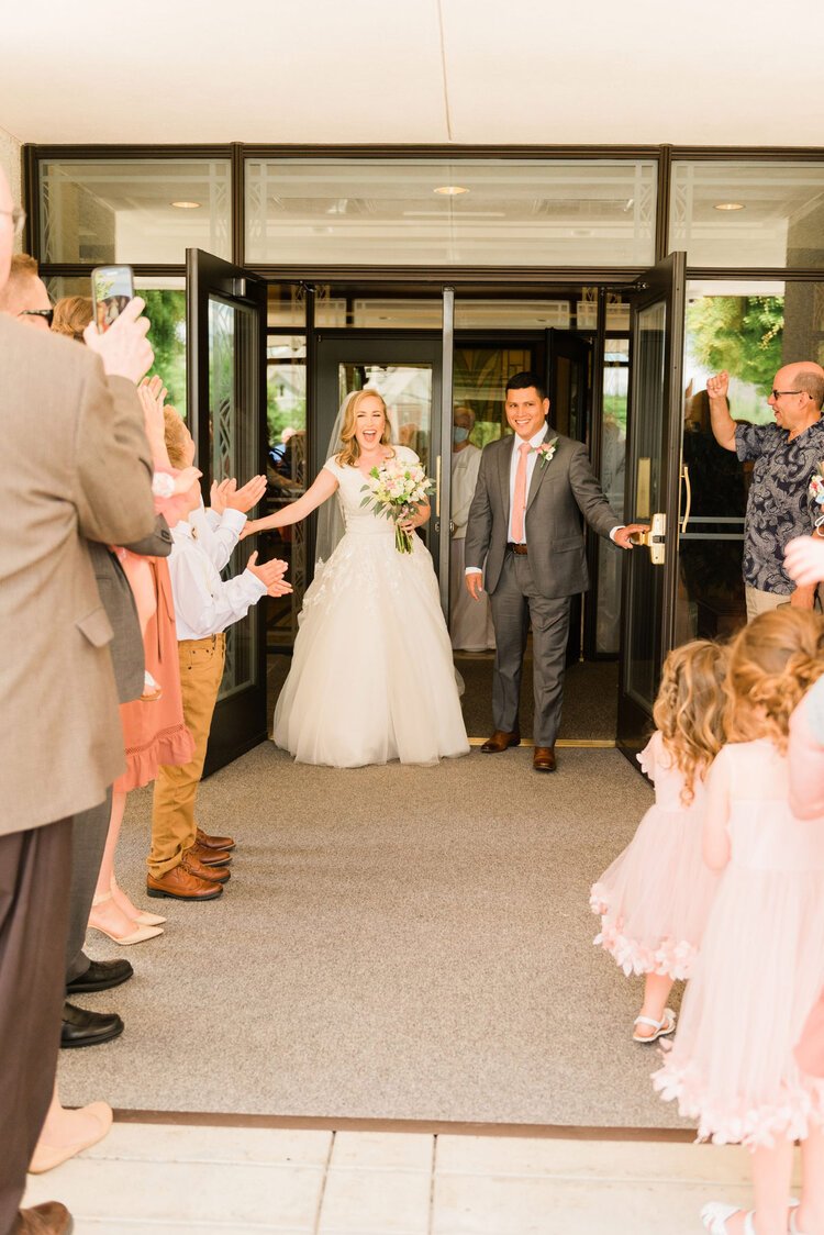  The happiness is captured on the faces of this bride and groom as they exit the temple and are greeted by their loved ones. Temple exit photos bride and groom newlyweds family cheering&nbsp; #ldstemplewedding #atlantageorgiaweddings #jacquieerickson