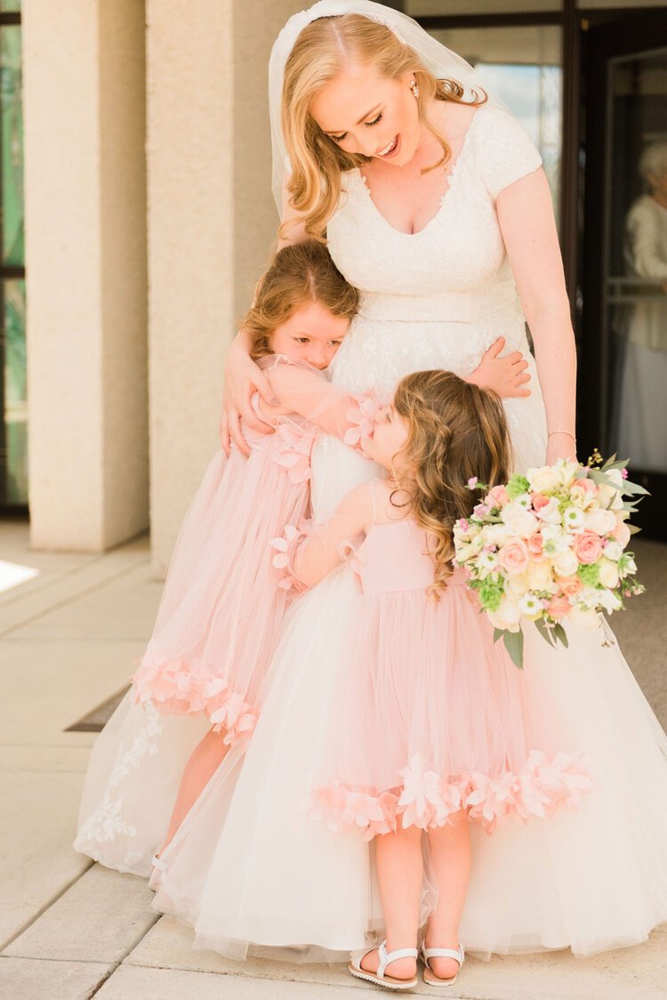  This beautiful bride is hugging her nieces as they celebrate her wedding at the Atlanta, Georgia temple. Bride and nieces flower girls #ldstemplewedding #atlantageorgiaweddings #jacquieericksonphotography #brideandneices #littlegirlswedding&nbsp; 