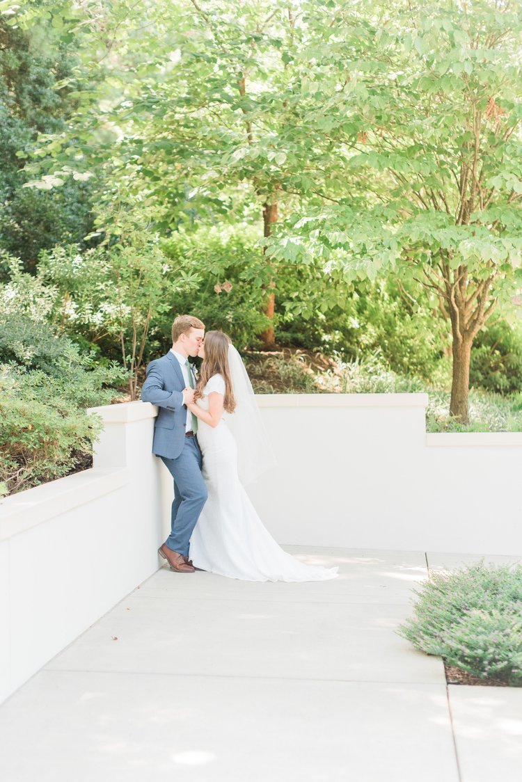  This tender kiss is highlighted by the contrast of green trees with the whiteness of the temple grounds. Kissing photo bride and groom trees background #ldstemplewedding #atlantageorgiaweddings #jacquieericksonphotography #brideandgroomkiss&nbsp; 