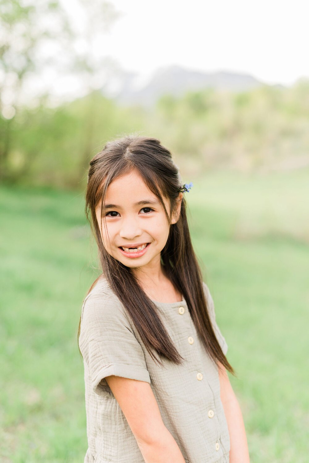  A little girl shyly smiles for a portrait photo taken by Jacquie Erickson, an Atlanta-based photographer. Personalized kid's portraits capture their childhood Fayetteville Peachtree City&nbsp; #childportraits #childrenphotographer #georgiaphotograph