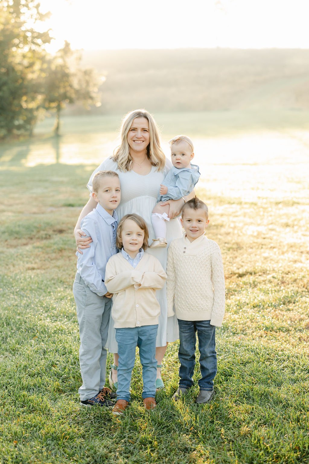  Jacquie Erickson with her four children surrounding her smiles into the camera. Client questionnaire Momtog course&nbsp; streamline workflow small business helpers Alpharetta Marietta #planoly #tailwind #diyphotographers #familylife 