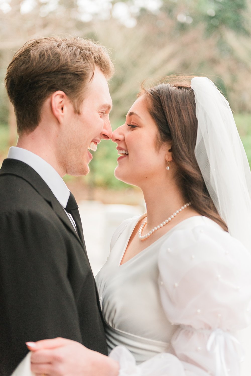  A bride and groom touch noses as they smile at each other during their wedding photos taken by Atlanta-based photographer, Jacquie Erickson. Professional wedding photographer wedding pictures #weddingphotographer #ldsweddings #atlantatemple #jacquie