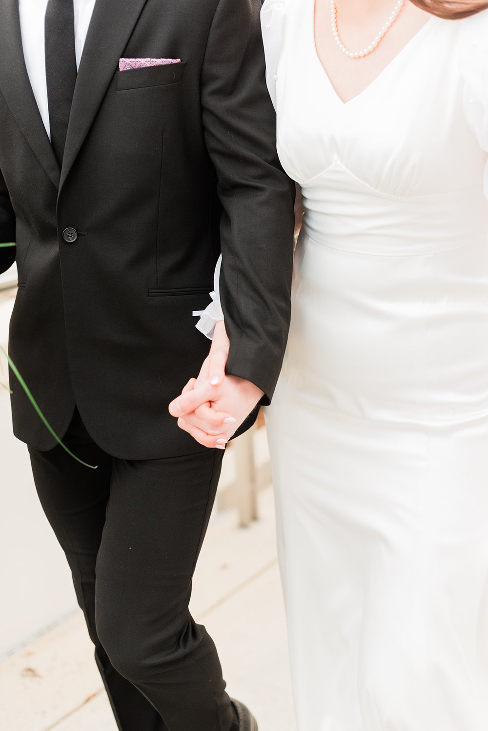  A husband and wife holding hands is the focus of this wedding photo captured by Jacquie Erickson. Holding hands wedding photographer Sharpsburg Roswell #weddingphotographer #ldsweddings #atlantatemple #jacquieerickson #newlyweds 