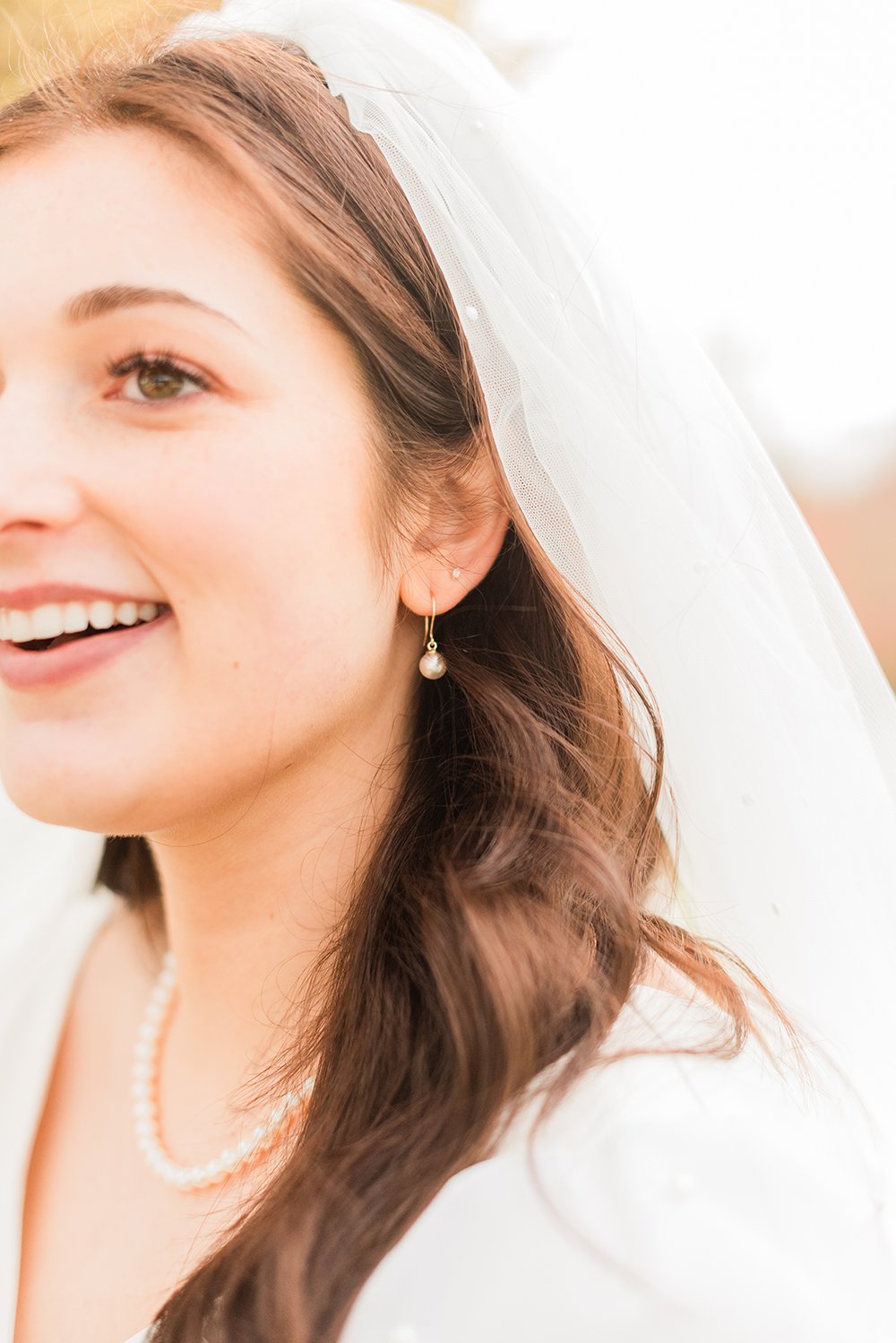  The focus is on the bride's earrings, hair, and veil in this wedding day photo taken by wedding photographer, Jacquie Erickson. Bridal photos wedding photographer detail shot Sharpsburg Roswell #weddingphotographer #ldsweddings #atlantatemple #jacqu