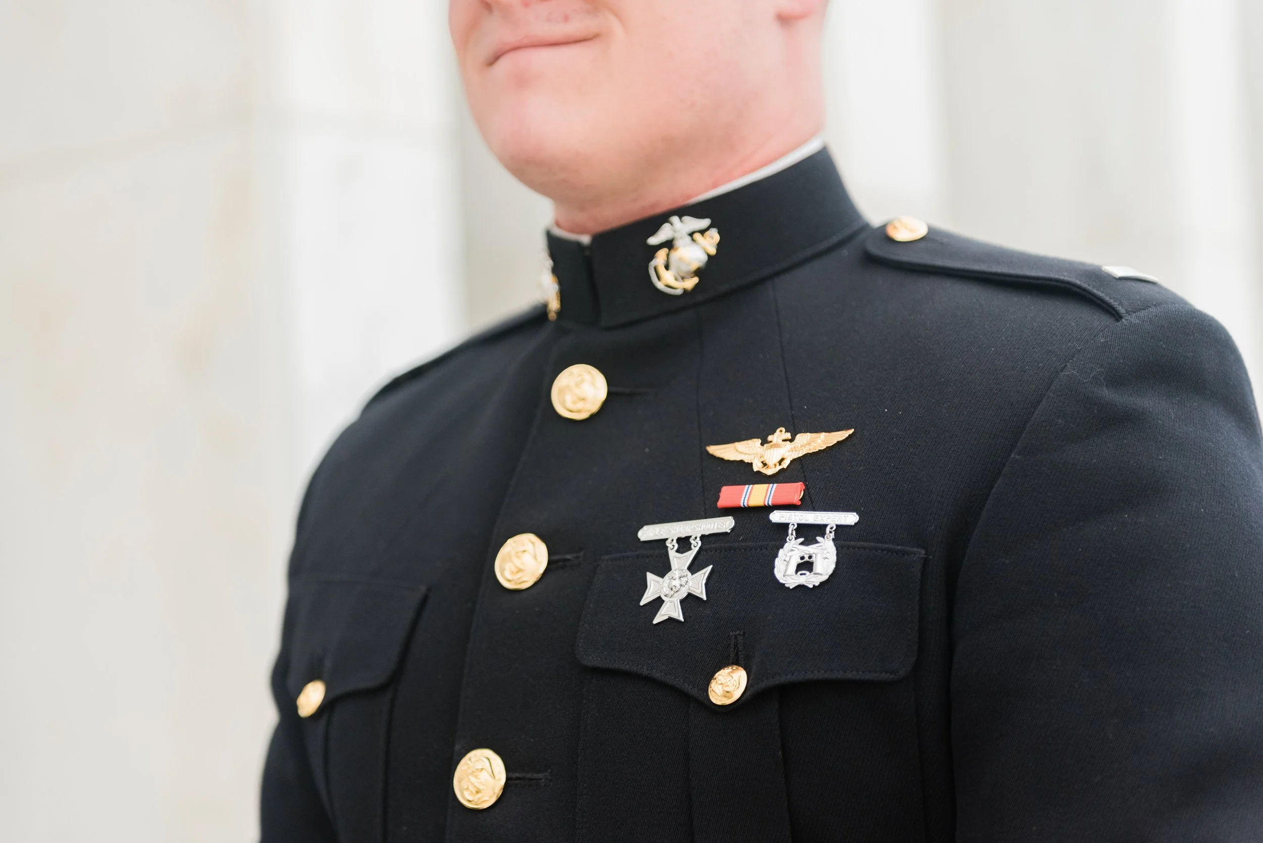 Close-up of a Marine wearing his dress uniform on his wedding day by Jacquie Erickson Photography. military wedding #JacquieEricksonPhotography #JacquieEricksonWeddings #DCLDSTemple #DCwedding #WinterWeddingDC #DCweddingphotographer