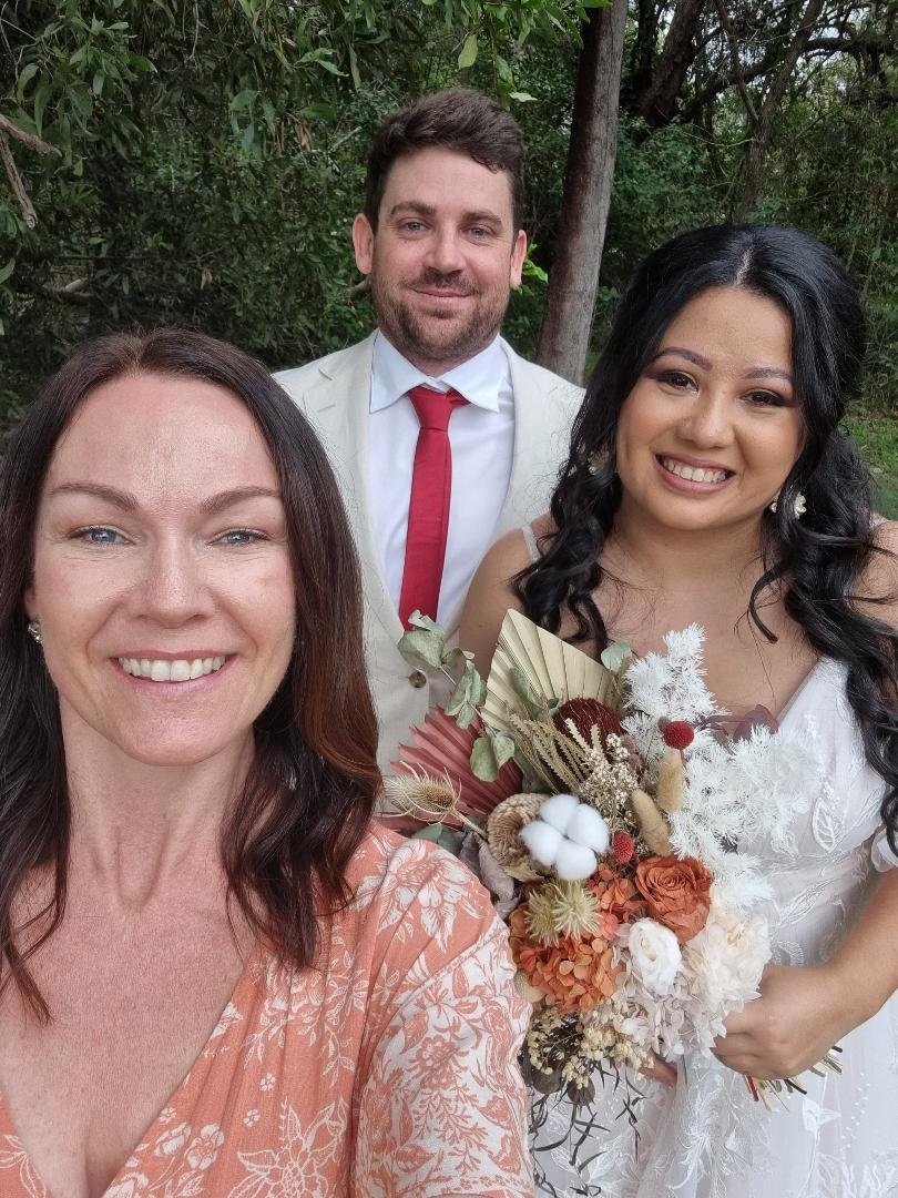 bride and groom smiling with stacey morris sunshine coast celebrant.jpg