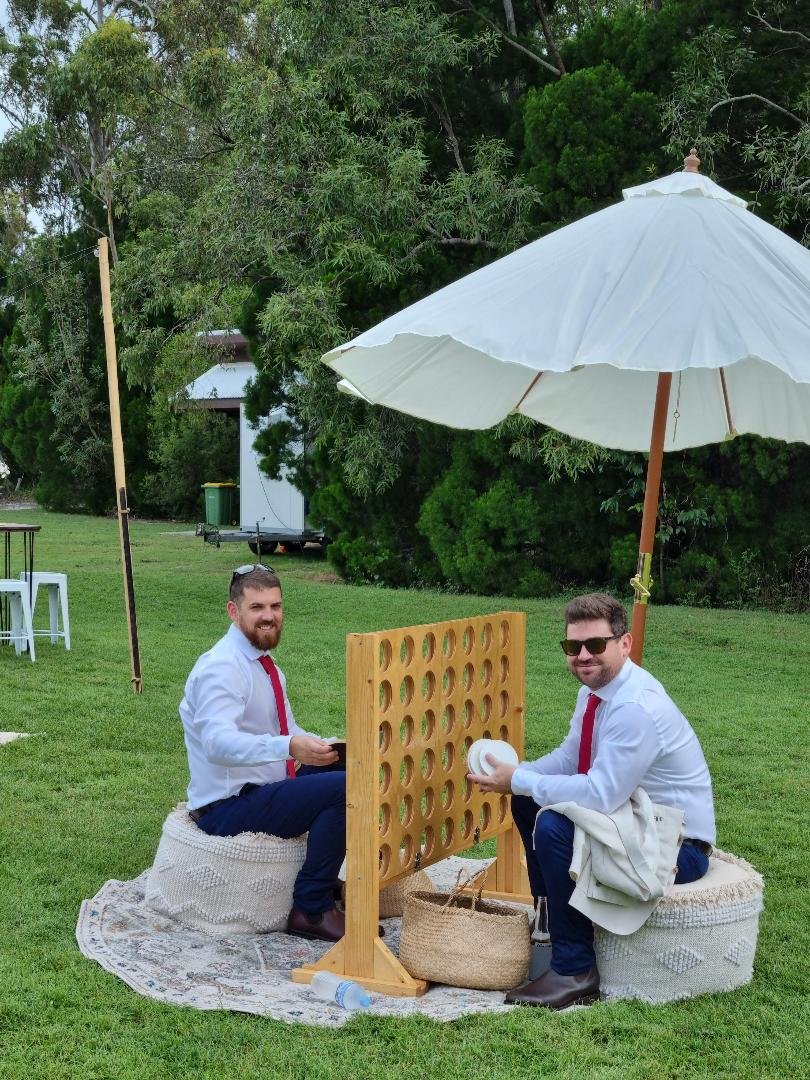 groom and best man playing connect 4.jpg