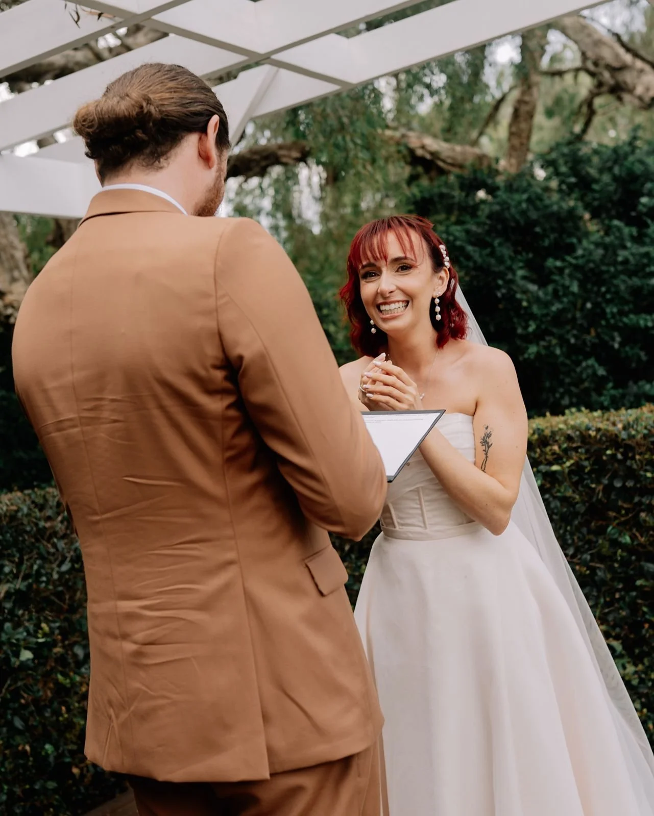 groom-reading-his-wedding-vows-during-sunshine-coast-ceremony